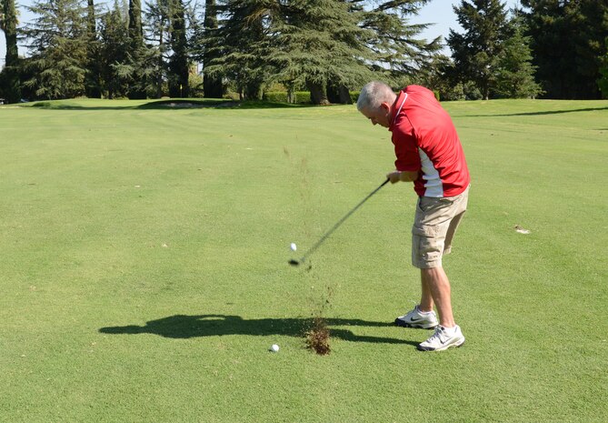 Col. John Trnka, 940th Wing commander, takes a swing during a Beale Military Liaison Committee golf tournament held at a local golf course Sept. 5, 2014. The event raised more than $80,000 for quality of life projects benefitting Beale Airmen and their families. (U.S. Air Force photo by John Schwab/Released)