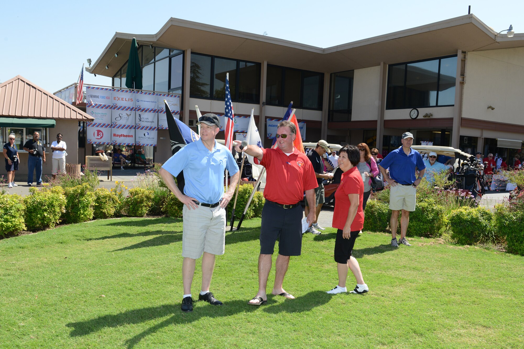 Col. Douglas Lee (left), 9th Reconnaissance Wing commander, speaks with members of the Beale Military Liaison Committee during an annual golf tournament held at a local golf course Sept. 5, 2014. The event raised more than $80,000 for quality of life projects benefitting Beale Airmen and their families. (U.S. Air Force photo by John Schwab/Released)