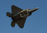 A United States Air Force F-22 Raptor performs a fly-by during the California Captial Airshow in Sacramento, Calif., Sept. 6, 2014. The Raptor carries its weapons internally to increase its stealth capability. (U.S. Air Force photo by Staff Sgt. Robert M. Trujillo/Released)