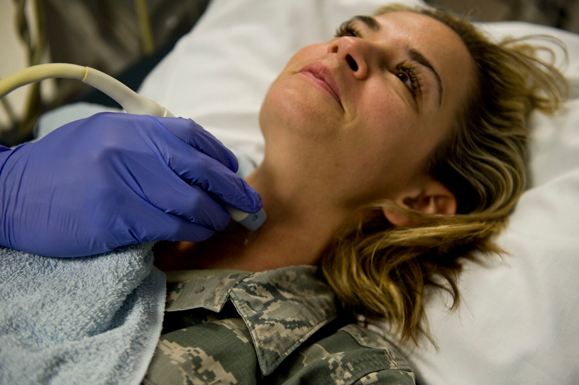 Staff Sgt. Tristan Traore, 99th Medical Surgical Operations Squadron ultrasound technologist, performs an ultrasound demonstration on Staff Sgt. Jessica Corley, 99th MSGS ultrasound technologist, at Mike O’ Callaghan Federal Medical Center on Nellis Air Force Base, Nev., Aug. 26, 2014. The diagnostic imaging department performs approximately 700 ultrasounds per month for Department of Defense and Department of Veterans Affairs medical beneficiaries. (U.S. Air Force photo by Airman 1st Class Mikaley Towle)