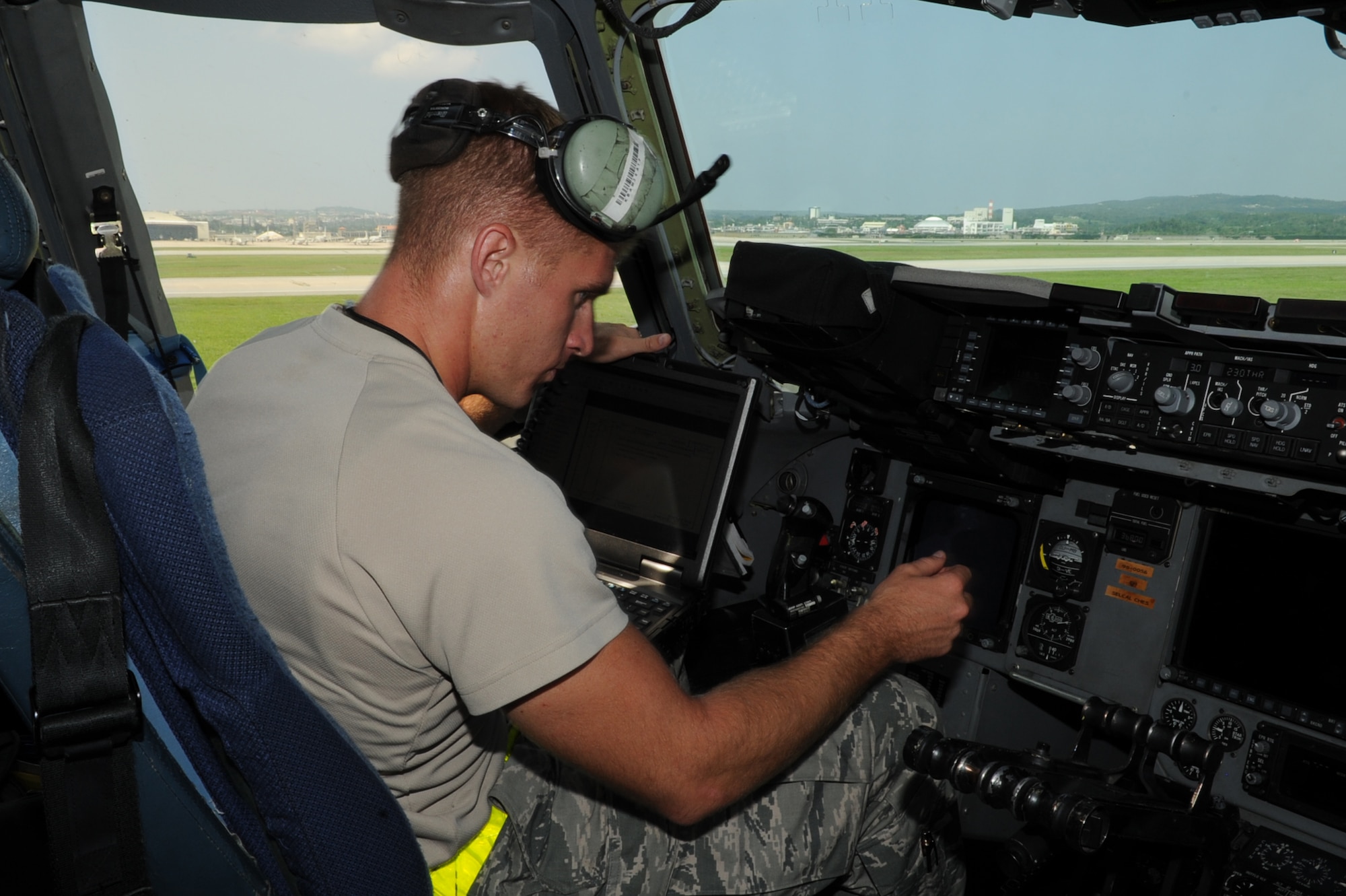 U.S. Air Force Staff Sgt. Nicholas Otos, 733rd Air Mobility Squadron avionics technician craftsman, completes the avionics fault checklist for the C-17 Globemaster III on Kadena Air Base, Japan, Sept. 9, 2014. The fault checklist is one of the means the 733rd AMS uses to ensure safe operation of the aircraft they maintain. (U.S. Air Force photo by Airman 1st Class Zackary A. Henry)