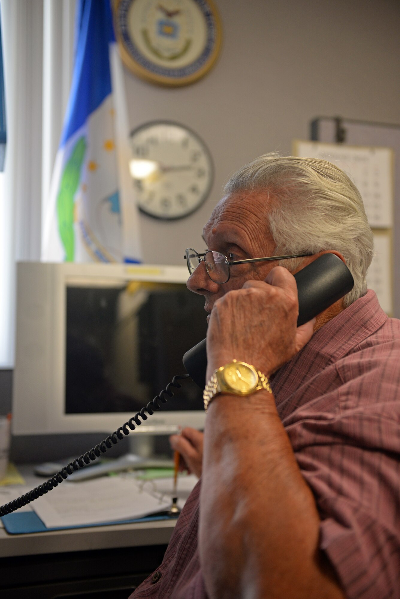 Retired Chief Master Sgt. John Steffen, a volunteer in the Scott Retiree Activities Office, answers a question about where to subscribe to the Command Post if living off base. Steffen keeps record of how many phone calls the office gets throughout the day, and helps retirees and their families’ information about everything from TRICARE and entitlements. The Indiana native said he speaks from experience about retiree matters, having been through it himself. (U.S. Air Force photo by Airman 1st Class Erica Crossen)