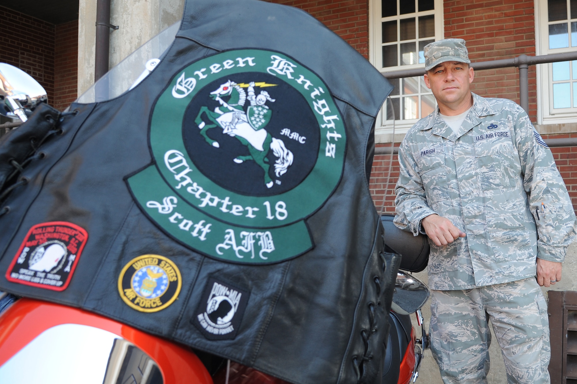Master Sgt. Ben Parish, Inspector General Management inspection manager, a rider with the Scott Air Force Base chapter of the Green Knights, helps new riders get the experience they need by riding with them to teach them the local customs and courtesies, Sept. 4, 2014 at Scott AFB, Ill. The Green Knights are open to all military and Department of Defense riders, Army, Air Force, Navy and Marines, and even retirees. (U.S. Air Force photo/Senior Airman Tristin English)