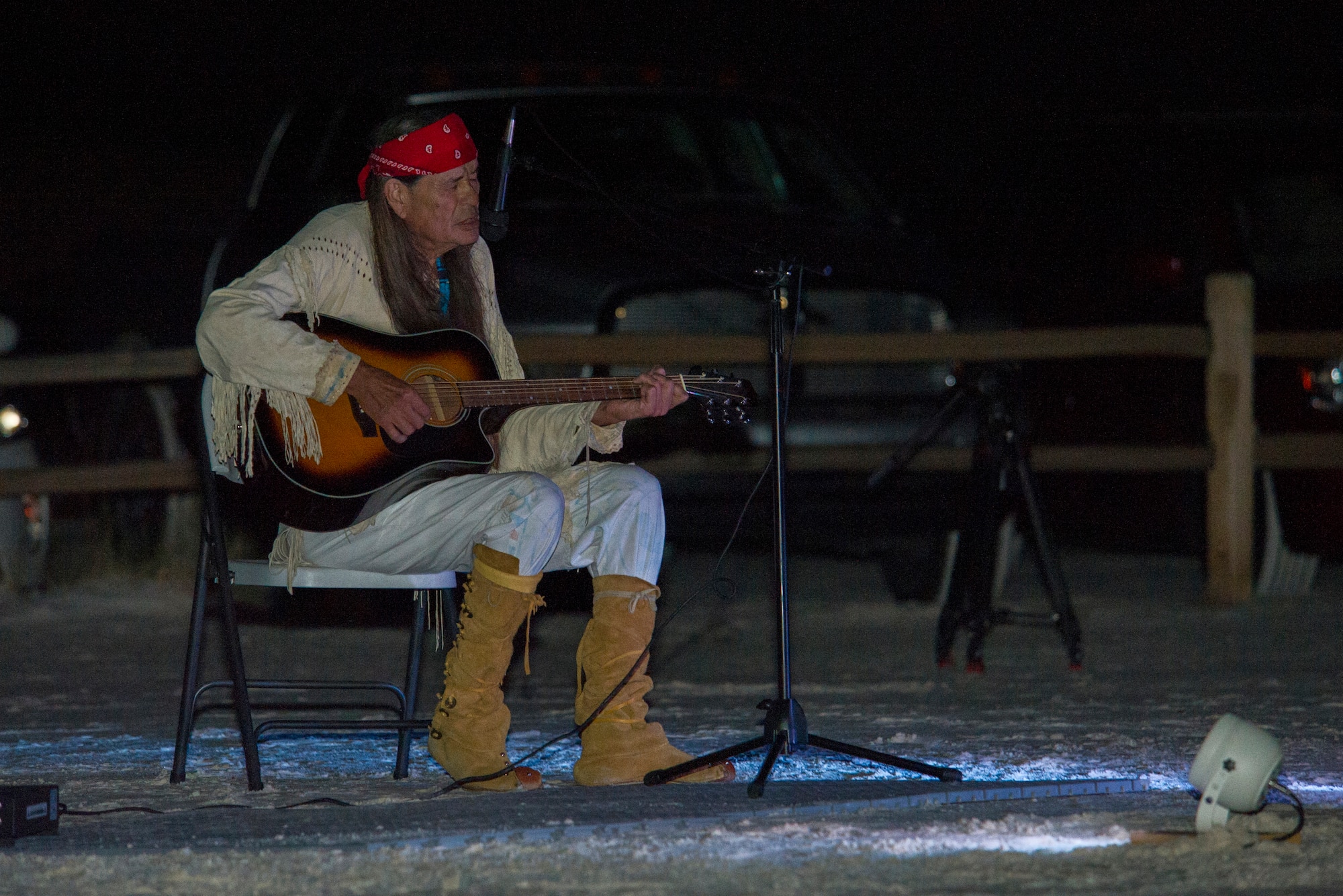 Ernie Dogwolf Lovato, a musician, story teller and native New Mexican, sings and plays the guitar during his Full Moon Night performance at White Sands National Monument, Sept. 8. White Sands National Monument hosts a monthly full moon night event where various featured guests and activities are planned for the guests to enjoy under a rising full moon. (U.S. Air Force photo by Airman 1st Class Aaron Montoya / Released)