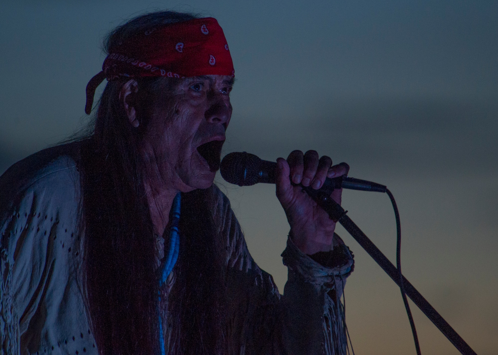 Ernie Dogwolf Lovato, a musician, story teller and native New Mexican, sings a song during his Full Moon Night performance at White Sands National Monument, Sept. 8. White Sands National Monument hosts a monthly full moon night event where various featured guests and activities are planned for the guests to enjoy under a rising full moon. (U.S. Air Force photo by Airman 1st Class Aaron Montoya / Released)