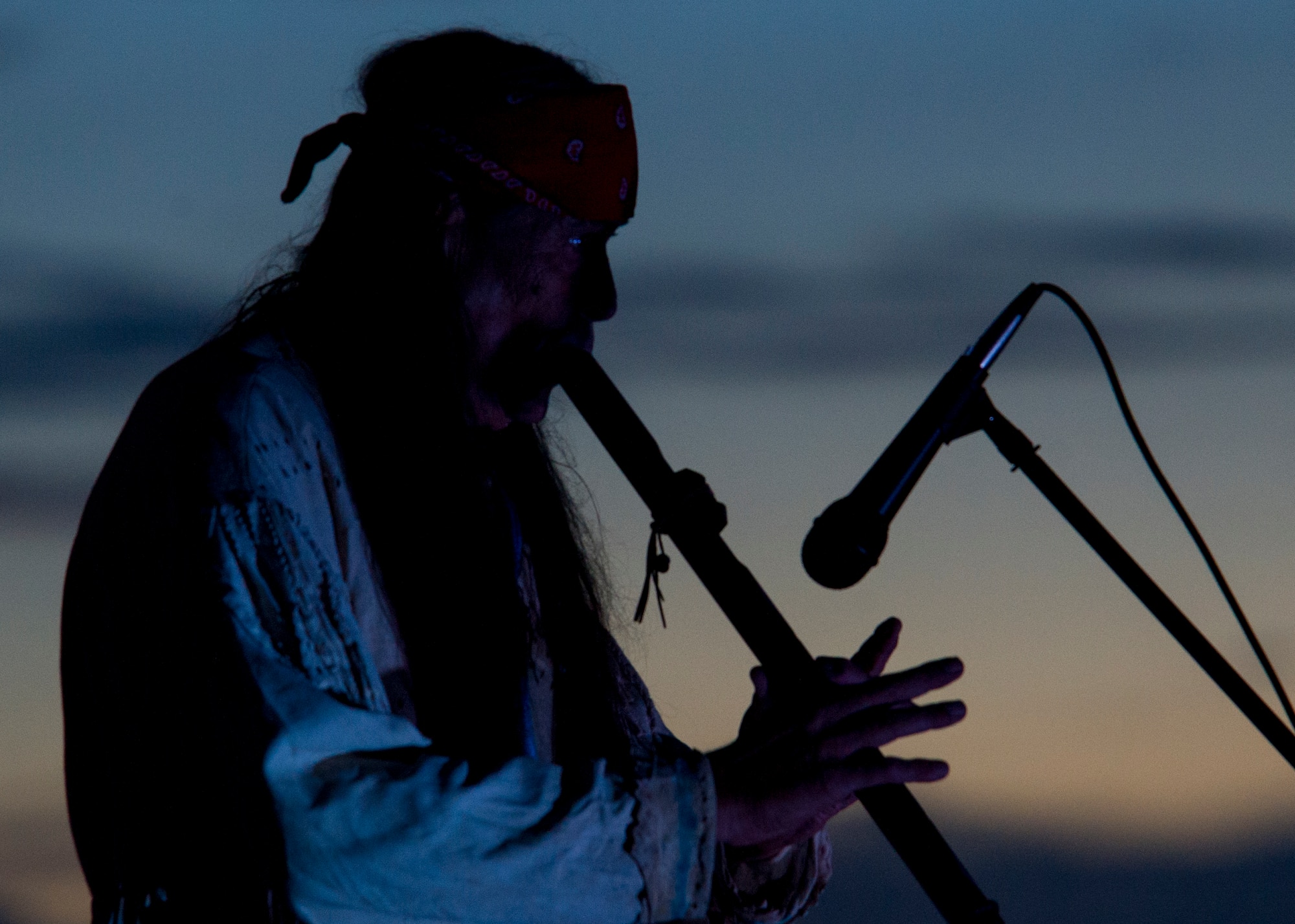 Ernie Dogwolf Lovato, a musician, story teller and native New Mexican, plays the flute during his Full Moon Night performance at White Sands National Monument, Sept. 8. White Sands National Monument hosts a monthly full moon night event where various featured guests and activities are planned for the guests to enjoy under a rising full moon. (U.S. Air Force photo by Airman 1st Class Aaron Montoya / Released)
