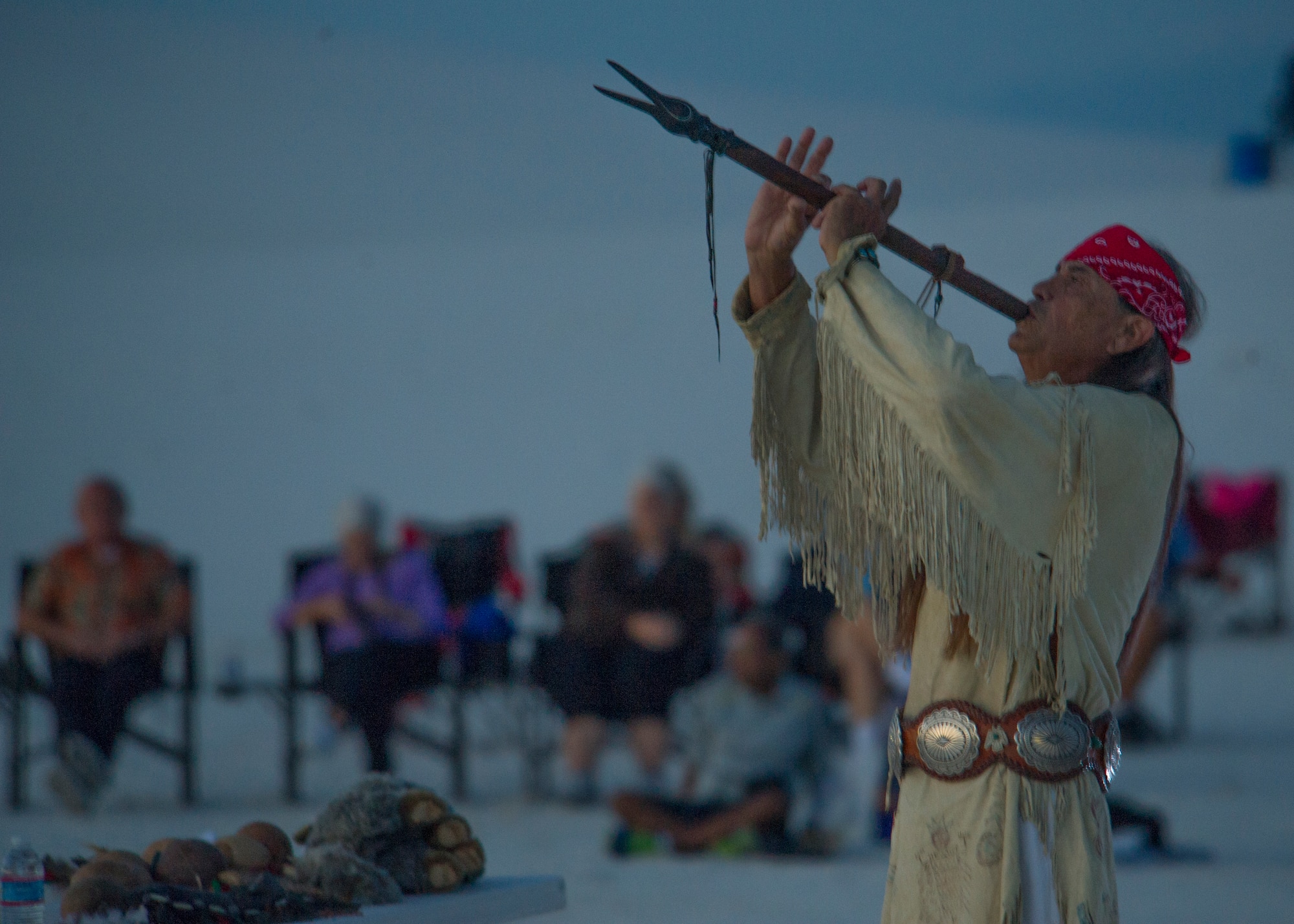 Ernie Dogwolf Lovato, a musician, story teller and native New Mexican, plays the flute during his Full Moon Night performance at White Sands National Monument, Sept. 8. White Sands National Monument hosts a monthly full moon night event where various featured guests and activities are planned for the guests to enjoy under a rising full moon. (U.S. Air Force photo by Airman 1st Class Aaron Montoya / Released)
