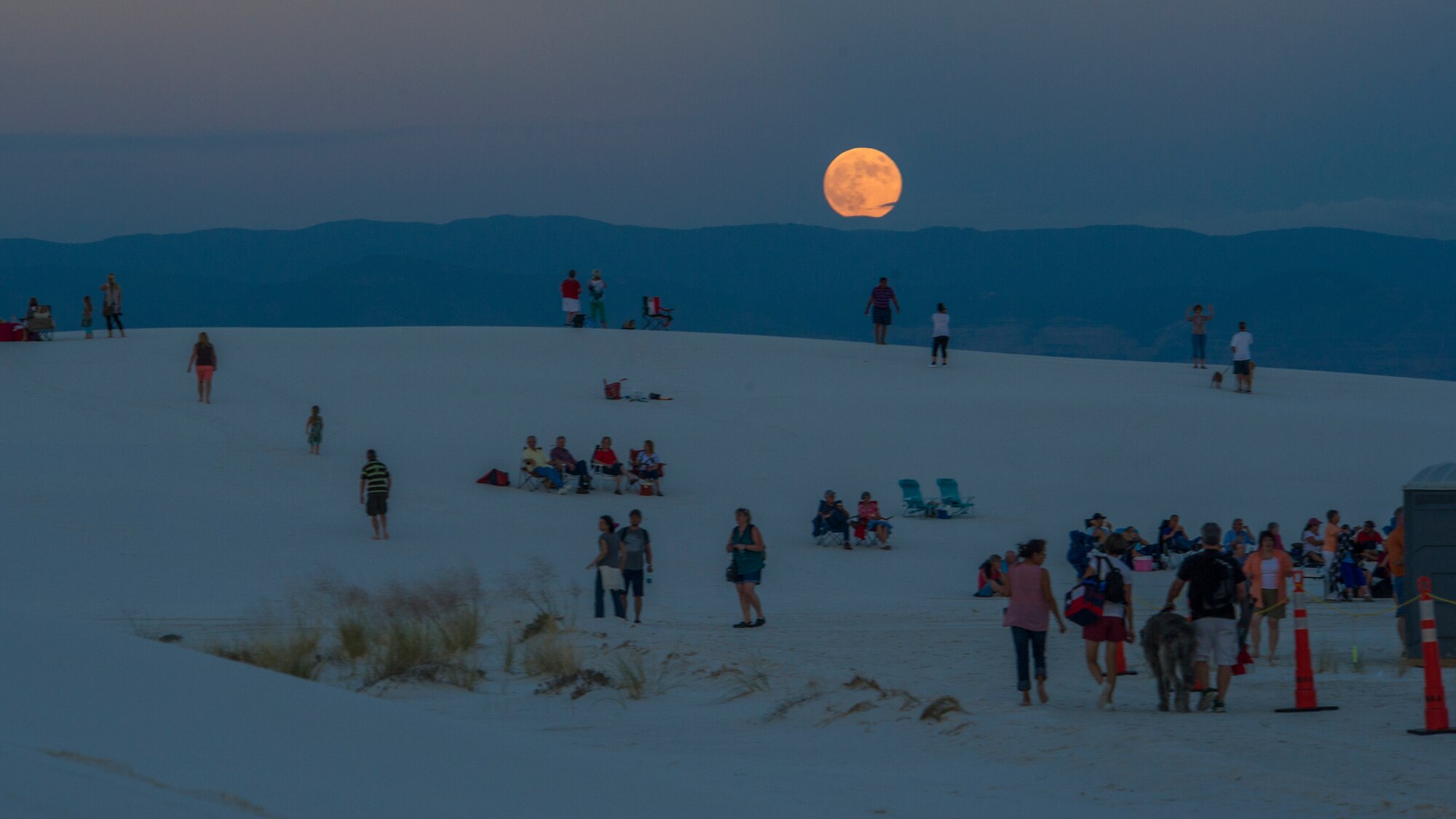 Residents of the Tularosa Basin prepare for the Full Moon Night event at White Sands National Monument, Sept. 8. White Sands National Monument hosts a monthly full moon night event where different guests and activities are planned for the guests to enjoy under a rising full moon. This month White Sands was host to Ernie Dogwolf Lovato, a musician, story teller and native New Mexican. (U.S. Air Force photo by Airman 1st Class Aaron Montoya / Released)