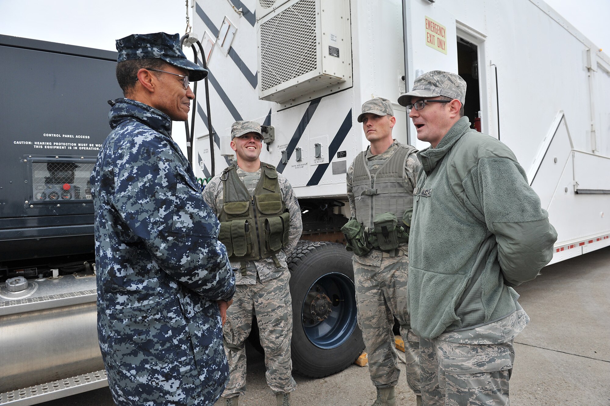Adm. Cecil D. Haney, U.S. Strategic Command commander, left, talks with 341st Maintenance Group members about payload transporter van operations Sept. 9 during a missile convoy display at Malmstrom Air Force Base, Mont. Tech. Sgt. Justin Richie, 341st Maintenance Operations Squadron, right, briefs the admiral as Staff Sgt. Tyler Hammack, 341st MOS, and Staff Sgt. Michael Johnson, 341st Missile Maintenance Squadron, look on. USSTRATCOM is one of nine DoD unified combatant commands and is charged with strategic deterrence, space operations, cyberspace operations, joint electronic warfare, global strike, missile defense, intelligence, surveillance and reconnaissance, combating weapons of mass destruction, and analysis and targeting. (U.S. Air Force photo/John Turner)