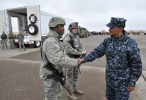 Master Sgt. Christopher Clark and 1st Lt. Matthew Cain, 741st Missile Security Forces Squadron convoy response force members, shake hands with Adm. Cecil D. Haney, U.S. Strategic Command commander Sept. 9 during a missile convoy display at Malmstrom Air Force Base, Mont. USSTRATCOM is one of nine DoD unified combatant commands and is charged with strategic deterrence, space operations, cyberspace operations, joint electronic warfare, global strike, missile defense, intelligence, surveillance and reconnaissance, combating weapons of mass destruction, and analysis and targeting. (U.S. Air Force photo/John Turner)