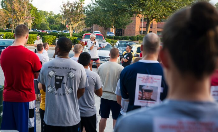 Guest speaker Gail Meminger Rush tells the heartbreaking story of her daughter’s suicide before the Run for A Life 5K Sept. 5, 2014, at Joint Base Charleston S.C. Rush’s daughter, Staff Sgt. Courtney Rush, who was stationed at JB Charleston, died by suicide Jan. 3, 2012. Rush talked to the group about resiliency, as well as suicide awareness and prevention. As part of Suicide Awareness Month, members of the Mental Health Clinic will host information booths at the Air Base Exchange, Sept. 12, 17 and 26 from 10:30 a.m. until 1:30 p.m.; the Gaylord Dining Facility, Sept. 10, 15 and 19 from 10:30 a.m. to 1 p.m.; the Air Base Bowling Alley, Sept. 24 and 29 from 10:30 a.m. to 1:30 p.m., and the Air Base Fitness Center, Sept. 5, 8 and 22 from 2 p.m. to 5 p.m. They will also be making personal visits to some workstations around the installation.  (U.S. Air Force photo/Staff Sgt. William O'Brien)