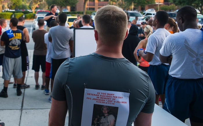 Runners listen to a safety briefing prior to running the Run For a Life 5K Sept. 5 2014, at Joint Base Charleston, S.C.  The Run For a Life 5K was held as part of the base’s monthly Fitness Challenge and helped to promote resiliency and raise awareness about suicide and prevention. Prior to the start of the run, Gail Meminger Rush, guest speaker, talked to the group and shared a personal story about the loss of a loved one. Rush lost her daughter to suicide in Jan. 3, 2012. As part of Suicide Awareness Month, members of the Mental Health Clinic will host information booths at the Air Base Exchange, Sept. 12, 17 and 26 from 10:30 a.m. until 1:30 p.m.; the Gaylord Dining Facility, Sept. 10, 15 and 19 from 10:30 a.m. to 1 p.m.; the Air Base Bowling Alley, Sept. 24 and 29 from 10:30 a.m. to 1:30 p.m., and the Air Base Fitness Center, Sept. 5, 8 and 22 from 2 p.m. to 5 p.m. They will also be making personal visits to some workstations around the installation. (U.S. Air Force photo/Staff Sgt. William O'Brien)