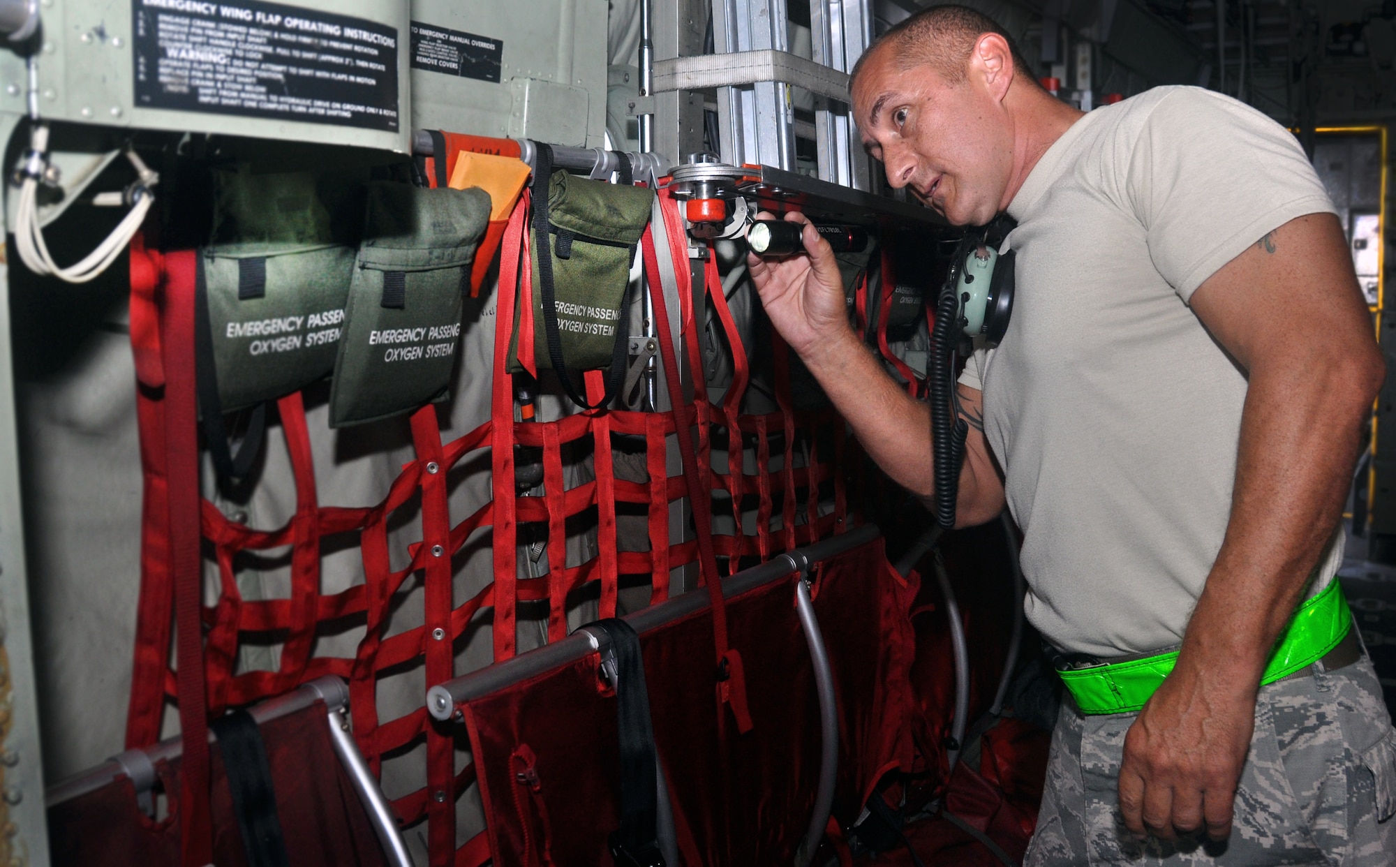 Tech. Sgt. Michael Santoy, a crew chief with the 440th Maintenance Squadron, performs an inspection of his C-130 H Hercules prior to a mission.  As a former Army paratrooper, Santoy jumped out of C-130s while assigned to the 7th Special Forces Group, formerly located at Ft. Bragg, N.C.  (U.S. Air Force Photo by Staff Sgt. Mark Thompson)