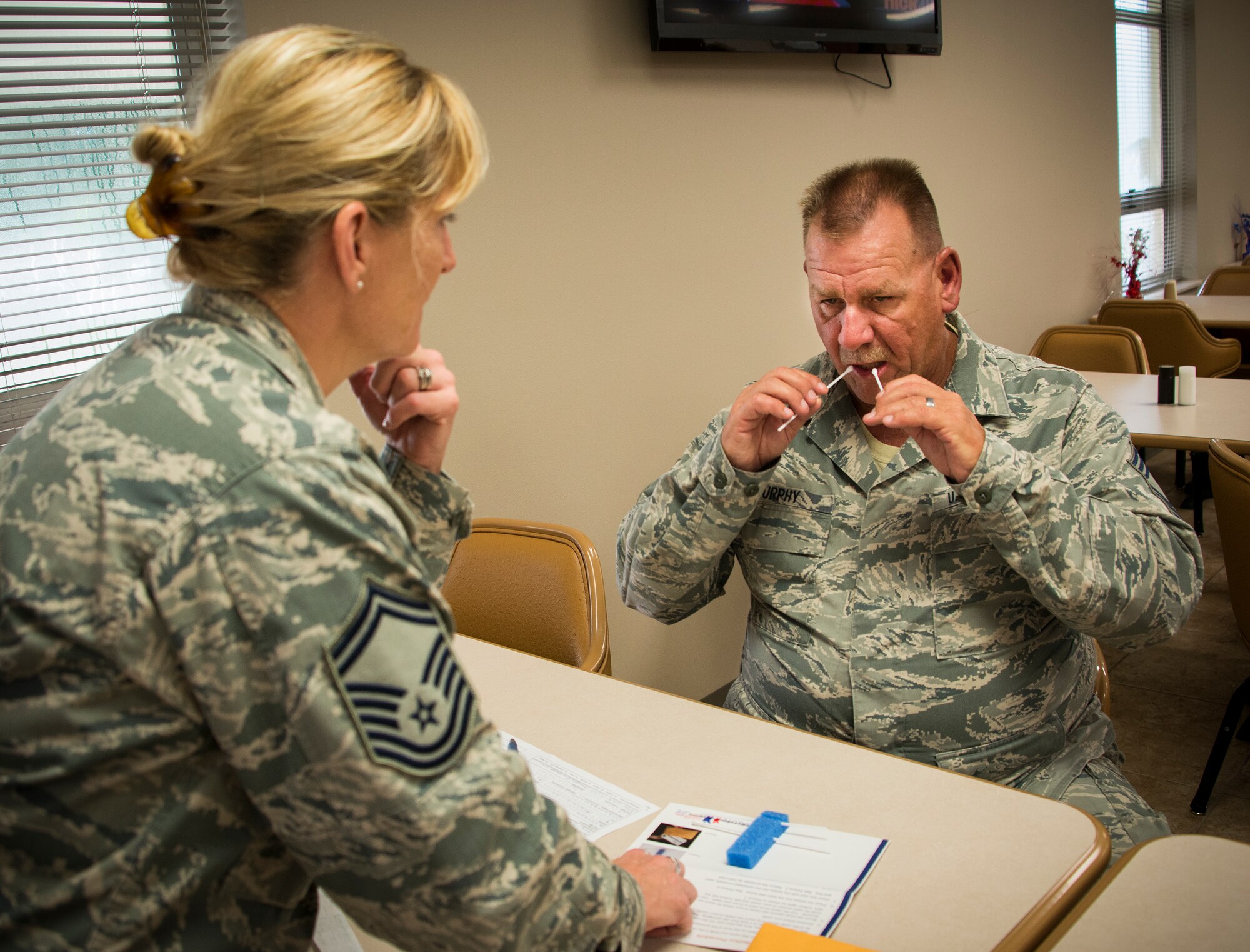 Chief Master Sgt. Kevin Murphy, 919th Special Operations Maintenance Squadron, swabs his cheek as part of his bone marrow donor registration during a drive Sept. 6 at Duke Field, Fla. The Department of Defense sponsored donor registration drive is currently underway at Eglin’s hospital and Base Exchange as well as locations on Hurlburt Field. The drive continues through Aug. 21. (U.S. Air Force photo/Tech. Sgt. Jasmin Taylor)
