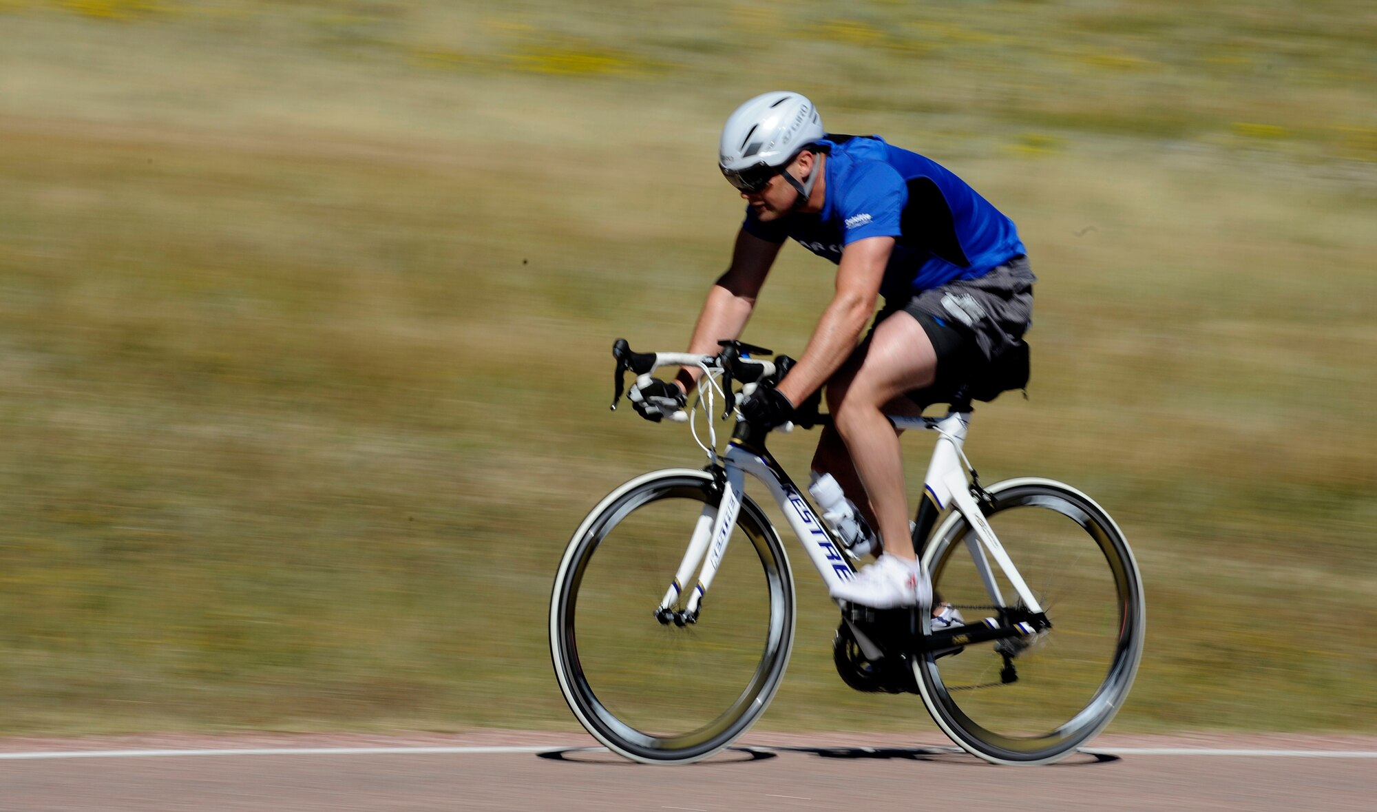 U.S. AIR FORCE ACADEMY, Colo. – Master Sgt. Benjamin “Paul” Horton, 21st Civil Engineer Squadron explosive ordnance disposal program manager, cycles to work as part of his cardio program while working out at the Academy Sept. 3. Horton is training for the first-ever Invictus Games, which will take place in London Sept. 10-14. Cycling is one of the six events Horton will be competing in. (U.S. Air Force photo/Airman 1st Class Rose Gudex)