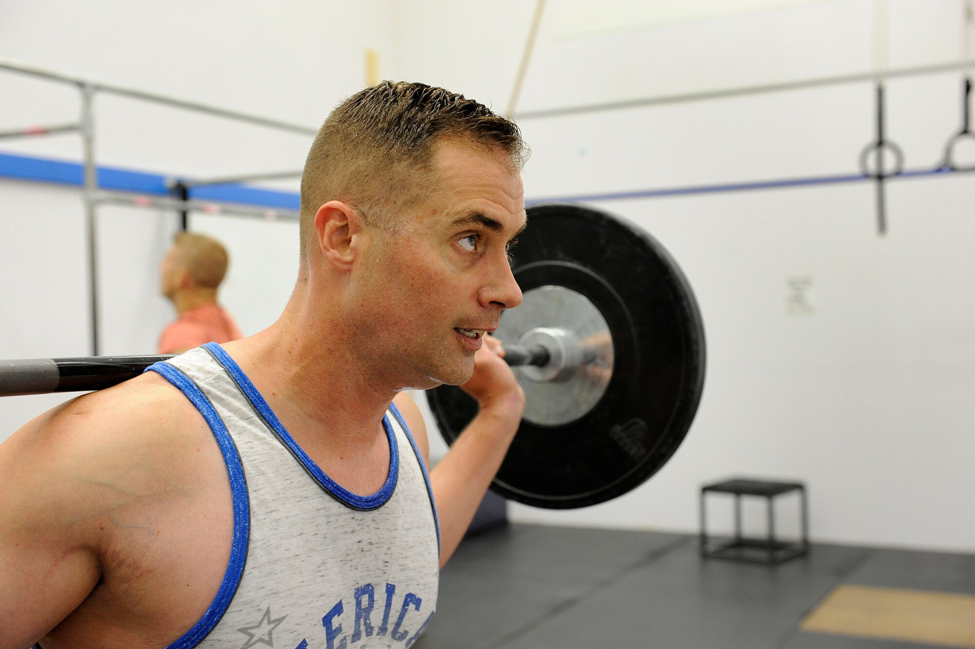 U.S. AIR FORCE ACADEMY, Colo. – Master Sgt. Benjamin “Paul” Horton, 21st Civil Engineer Squadron explosive ordnance disposal program manager, does squats during his workout at the Academy Fitness Center Sept. 3. Horton is training for the first-ever Invictus Games, which will take place in London Sept. 10-14. The Games will help combat warriors prove they still have a purpose and cannot be defeated just from being wounded in combat. (U.S. Air Force photo/Airman 1st Class Rose Gudex)