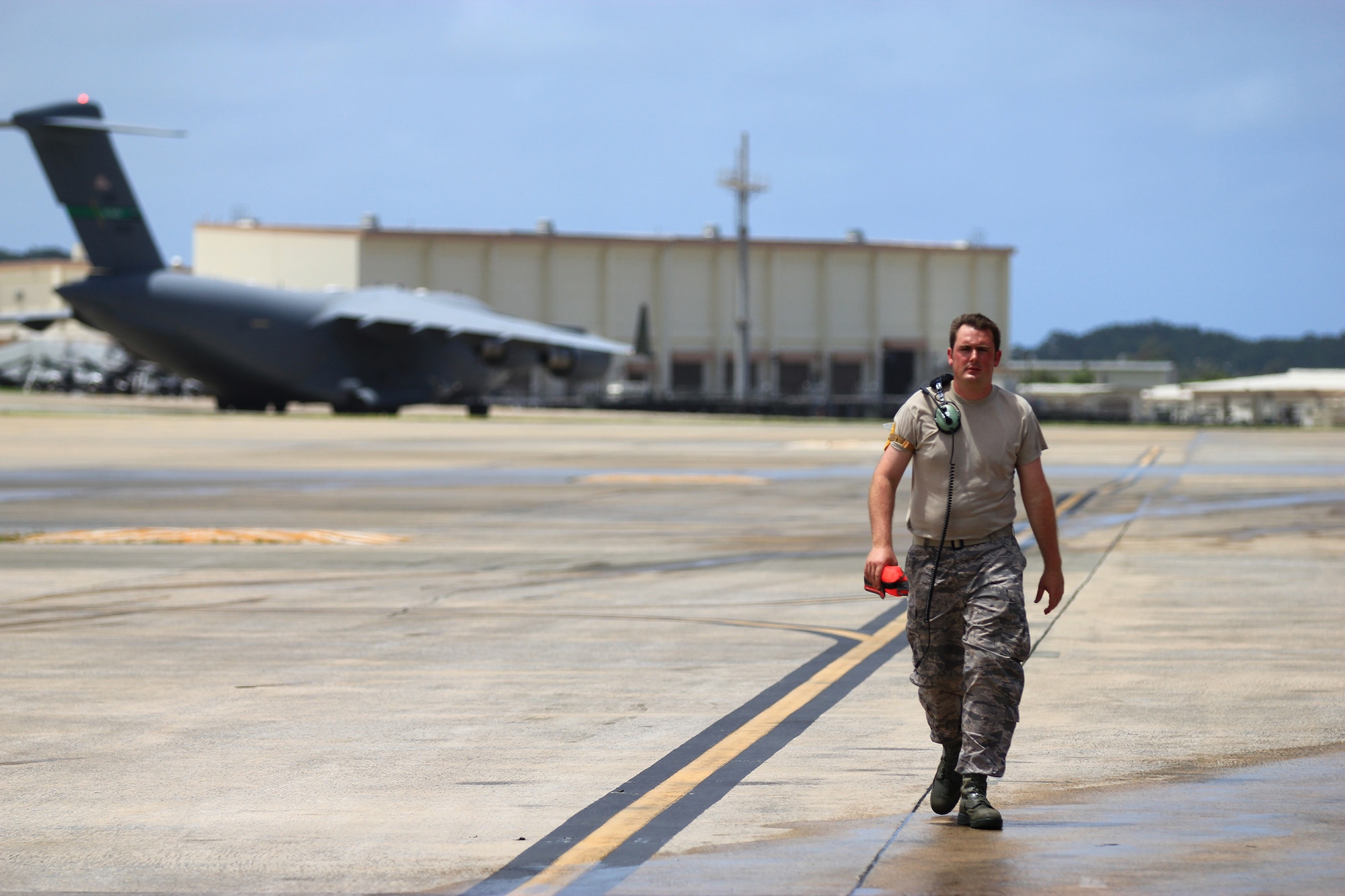 KADENA AIR BASE, Japan – Staff Sgt. Timothy Emberton, 445th Aircraft Maintenance Squadron avionics guidance and control technician, walks away after taxiing a C-17 Globemaster III at Kadena Air Base, Okinawa, Japan, July 29, 2014. (U.S. Air Force photo/Tech. Sgt. Patrick O’Reilly)