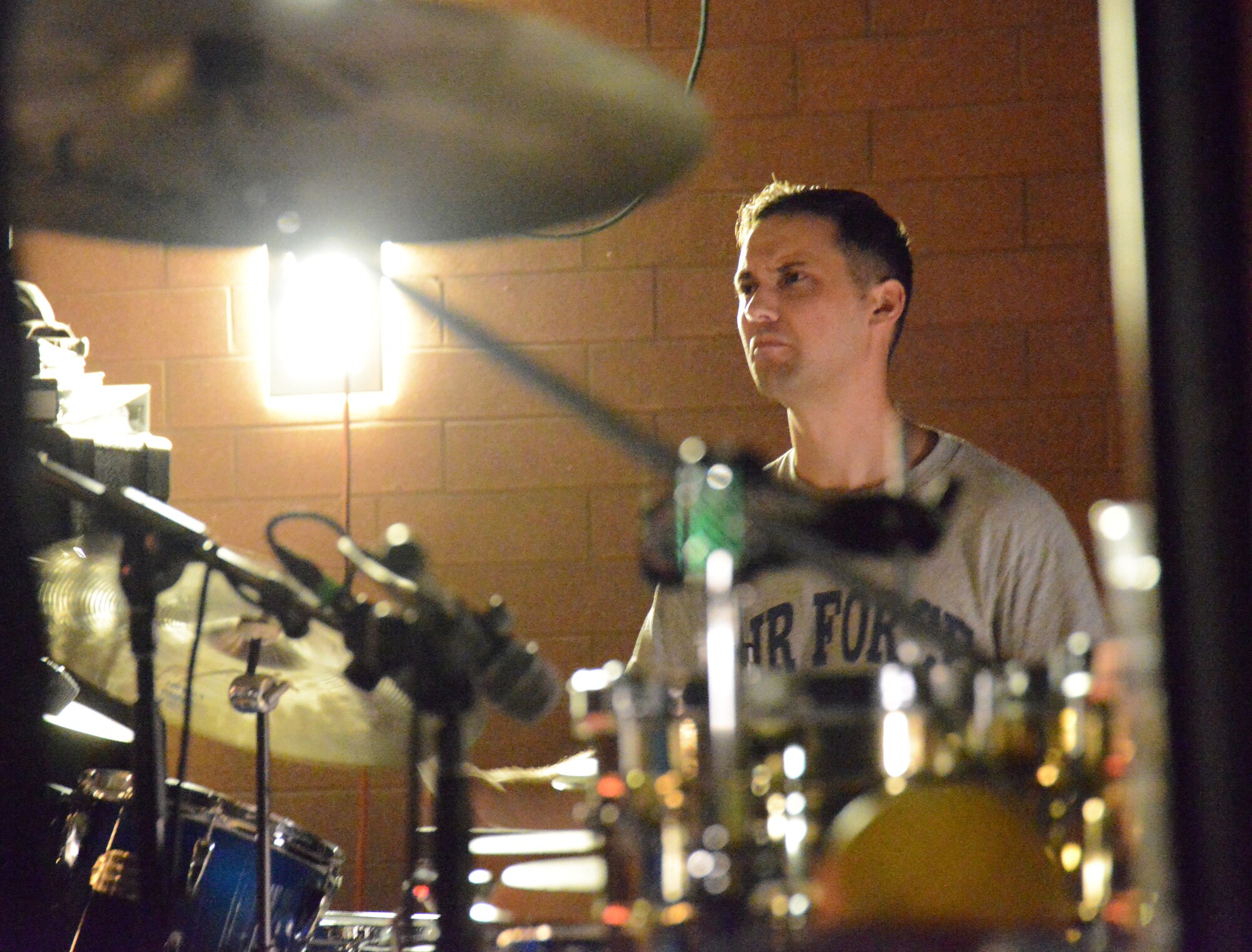 Airmen from the Air National Guard Band of the Northeast's "High Altitude" rock band perform at the Enlisted Leadership symposium, held at Camp Dawson, W.V., Aug. 26-28. The band performs for Guard units throughout the Northeast U.S. as well as for troops deployed overseas. (U.S. Air National Guard photo by Senior Airman John E. Hillier)