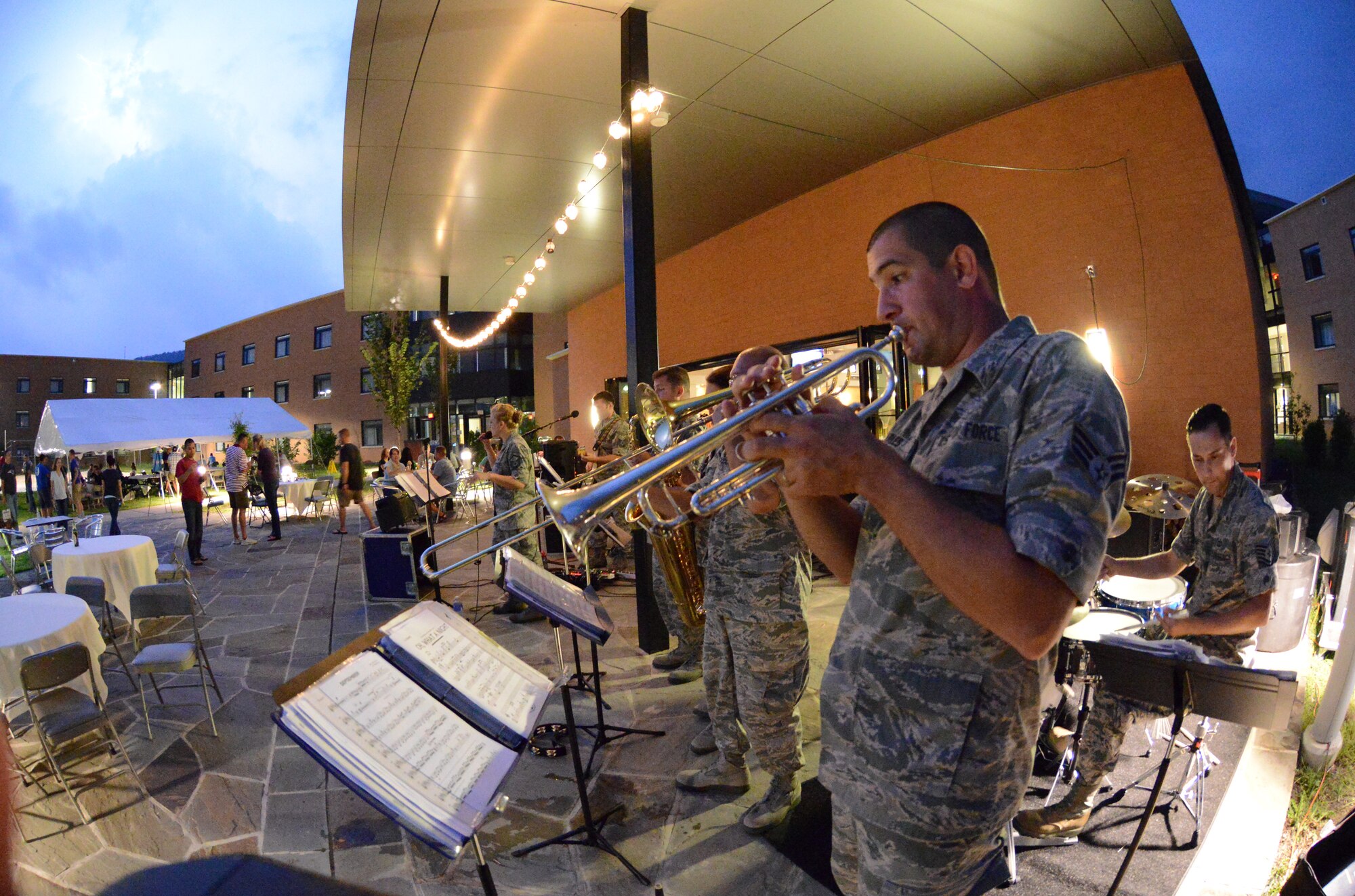The Air National Guard Band of the Northeast's "High Altitude" rock band lights up the night at the Enlisted Leadership Symposium Aug. 27, 2014, at Camp Dawson, W.V. The band performs for Air National Guard events across the northeast United States and for troops deployed overseas. (U.S. Air National Guard photo by Senior Airman John E. Hillier)