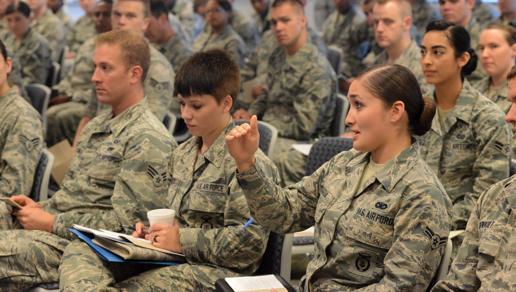 Airman 1st Class Denise J. Garcia, with the 190th Air Refueling Wing, Kansas Air National Guard, responds to a question from Chief Master Sgt. James W. Hotaling, chief master sergeant of the ANG, during a discussion at the Enlisted Leadership Symposium, held at Camp Dawson, W.V., Aug. 26-28, 2014. Hotaling spoke to junior enlisted Airmen about leadership, the enlisted force structure and his Aim Points for the Guard. (U.S. Air National Guard photo by Senior Airman John E. Hillier)