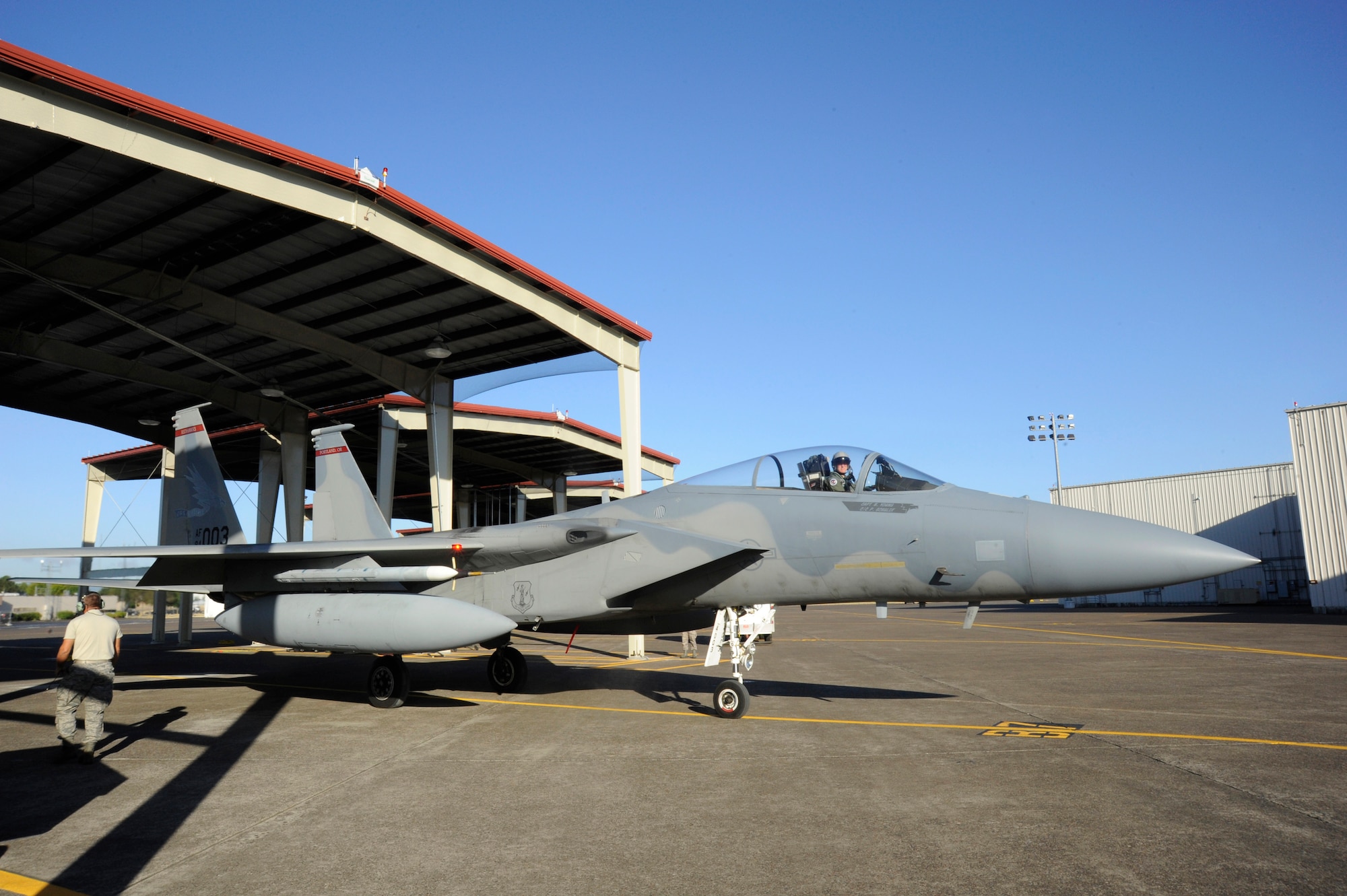 An F-15 Eagle from the 142nd Fighter Wing begins to taxi out of the new aircraft shelter recently constructed at the Portland Air National Guard Base, Ore., Sept. 4, 2014. (U.S. Air National Guard photo by Tech. Sgt. John Hughel, 142nd Fighter Wing Public Affairs/Released)