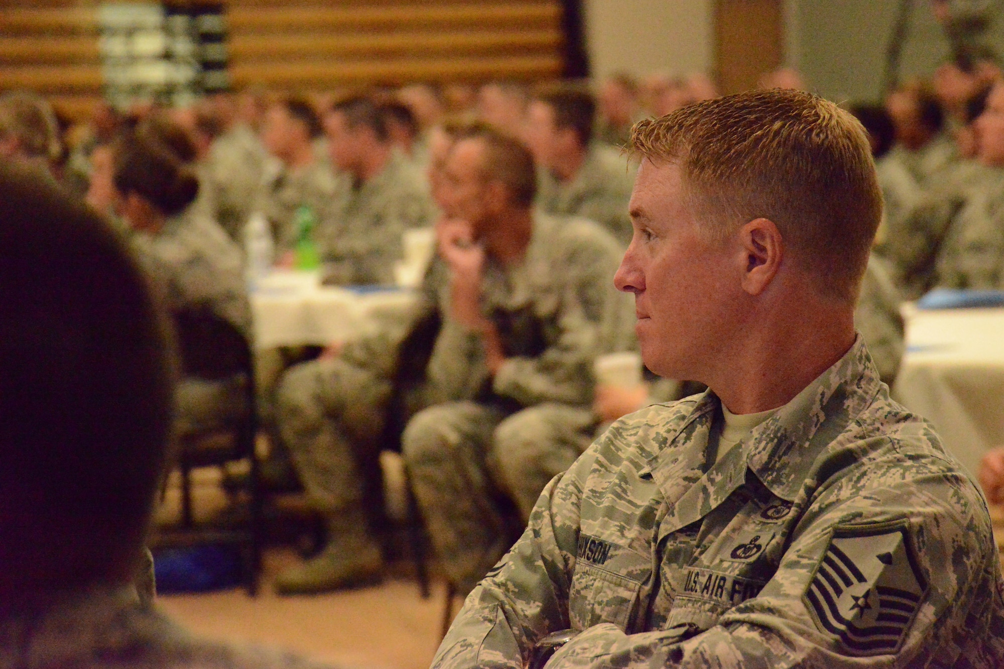 Master Sgt. Seaton Hixon of the 172nd Airlift Wing, Mississippi Air National Guard listens to presenters speak about the importance of the National Guard and professional Airmanship at the Enlisted Leadership Symposium held at Camp Dawson, W.V., Aug. 26-28, 2014. (U.S. Air National Guard photo by Senior Airman John E. Hillier)