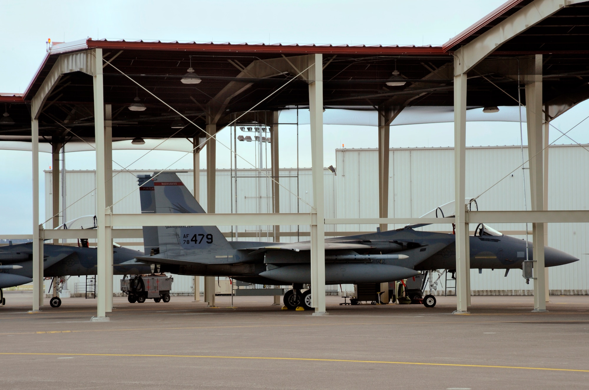 F-15 Eagles from the 142nd Fighter Wing sit ready in nine new aircraft shelters at the Portland Air National Guard Base, Ore., Aug. 28, 2014. (U.S. Air National Guard photo by Tech. Sgt. John Hughel, 142nd Fighter Wing Public Affairs/Released)