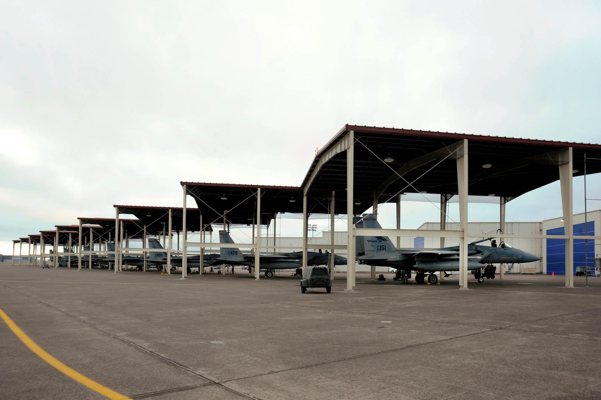 A view of the Portland Air National Guard Base, Ore., flightline, Aug. 28, 2014, after nine new aircraft shelters have been completed to help protect the 142nd Fighter Wing F-15 Eagles from environmental elements. (U.S. Air National Guard photo by Tech. Sgt. John Hughel, 142nd Fighter Wing Public Affairs/Released)