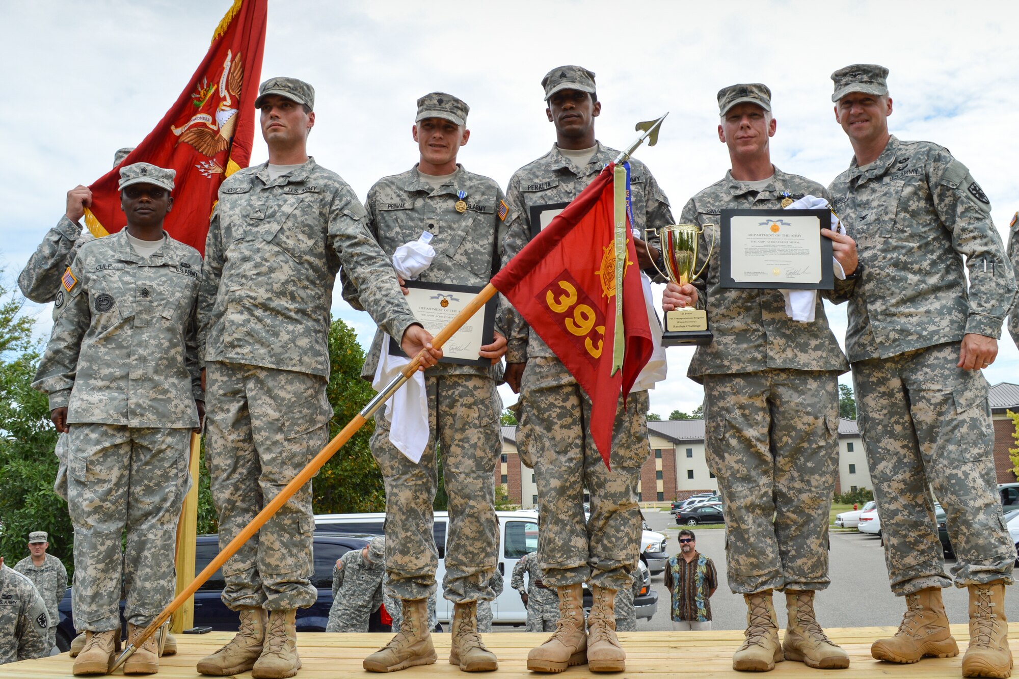 Members of the 393rd Harbor Master Operations Detachment, 11th Transportation Battalion, 7th Trans. Bde. (Ex.), receive accolades after placing first at the Resolute Challenge at Fort Eustis, Va., Sept. 5, 2014. The team demonstrated a resolute attitude while negotiating physically and mentally demanding events during challenge. (U.S. Army photo by Spc. Marian Alleva/Released)