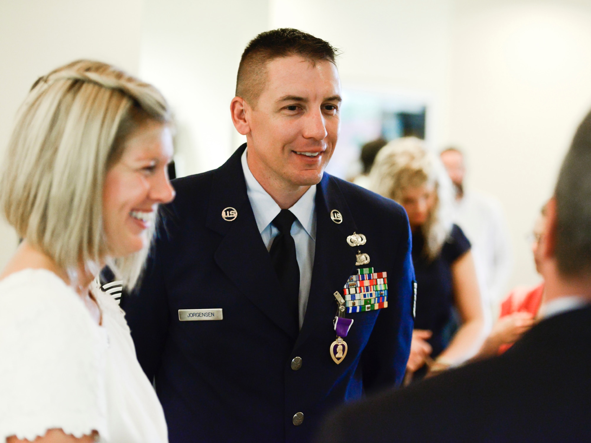 Oklahoma Air National Guard Tech. Sgt. Kody Jorgensen, assigned to the 138th Logistics Readiness Squadron, speaks with ceremony guests after receiving a Purple Heart Sept. 6, 2014, at the Tulsa Air National Guard base, Tulsa Okla. Jorgensen was wounded August 27, 2012, while serving in Afghanistan with the Georgia National Guard's 265th Regional Support Group, Agri-business Development Team II.  (U.S. National Guard photo by Master Sgt.  Mark A. Moore/Released)