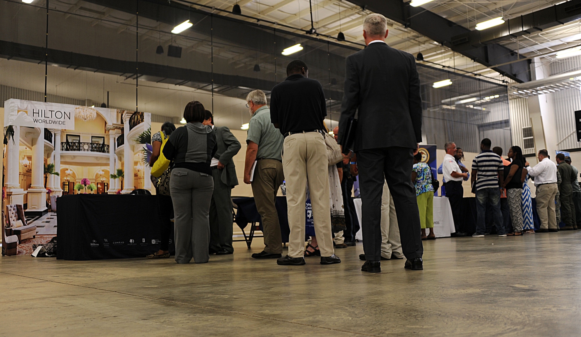 Actively searching job seekers wait in line to speak with an employer from Hilton Worldwide at the “Hiring our Heroes” event at the Cramton Bowl in Montgomery Ala., Sept. 9, 2014. “Hiring our Heroes” has confirmed more than 265,000 hires to date. (U.S. Air Force photo by Airman 1st Class Alexa Culbert)