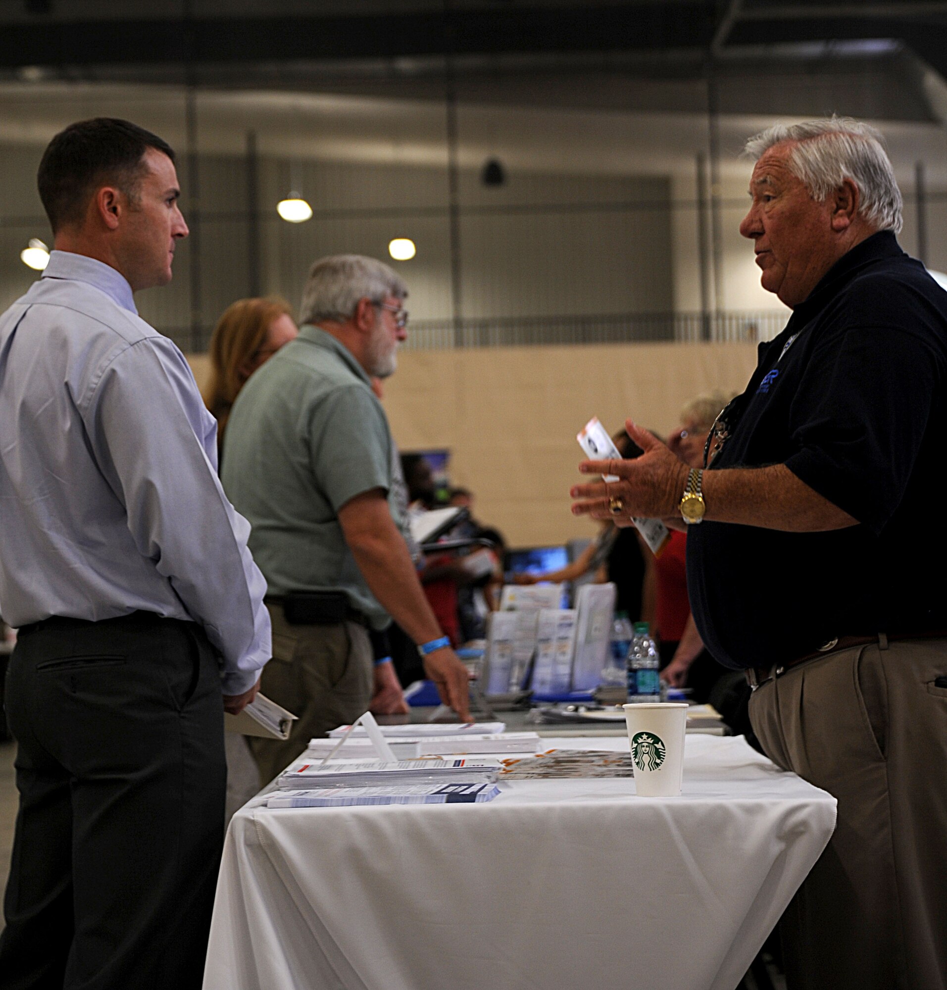 John Adams, Alabama Committee executive director, explains the employment rights granted to reservists when returning from military service to a jobseeker at the “ Hiring our Heroes” event at the Cramton Bowl in Montgomery Ala., Sept. 9, 2014. The event is a free job fair and workshop provided to service members, veterans, and their spouses. (U.S. Air Force photo by Airman 1st Class Alexa Culbert)