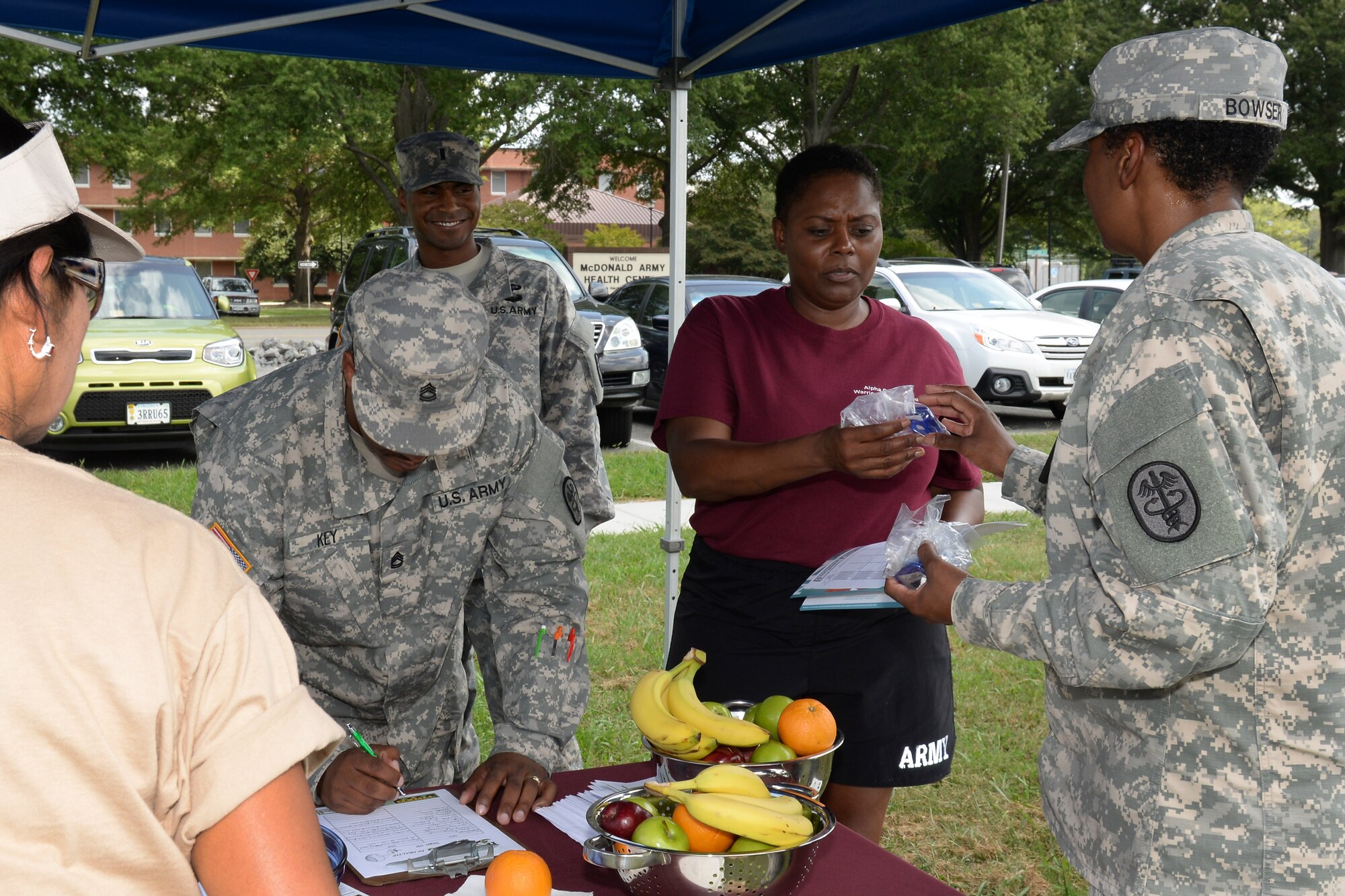 U.S. Army Maj. Tameka Bowser, Army Public Health Nursing chief, hands out pedometers to Soldiers during a Home Run for Health event at Fort Eustis, Va., Sept. 3, 2014. The event was part of the Performance Triad’s plan to improve readiness and increase resilience through public health initiatives and leadership engagement. (U.S. Air Force photo by Staff Sgt. Teresa J. Cleveland/Released)