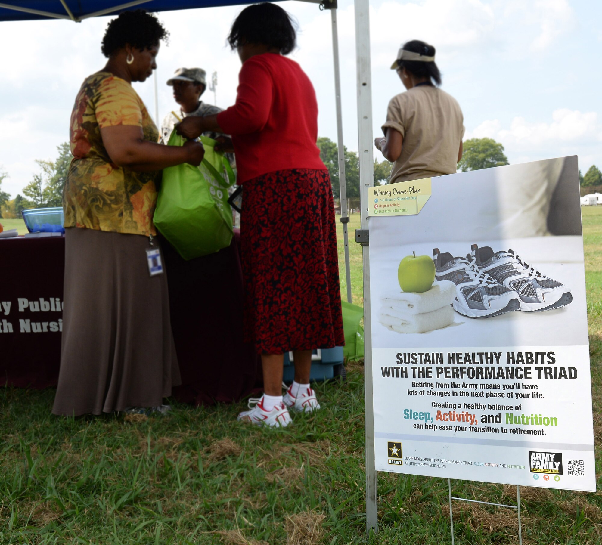 Members of Army Public Health Nursing provide Joint Base Langley-Eustis, Va., community members with information about the Performance Triad plan during a Home Run for Health event at Fort Eustis, Va., Sept. 3, 2014. The event wrapped up a three-month campaign to encourage participants to get more sleep, increase daily activity and make healthier nutritional choices. (U.S. Air Force photo by Staff Sgt. Teresa J. Cleveland/Released)