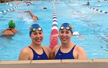 Second Lt. Mary Holman, 3rd Space Operations Squadron, and 2nd Lt. Sarah Holman, 2nd Space Operations Squadron, prepare to warm up prior to a race Aug. 3 at the FINA Masters World Championships in Montreal, Quebec, Canada. The twin sisters each logged multiple top-10 finishes during the competition. (Courtesy photo) 