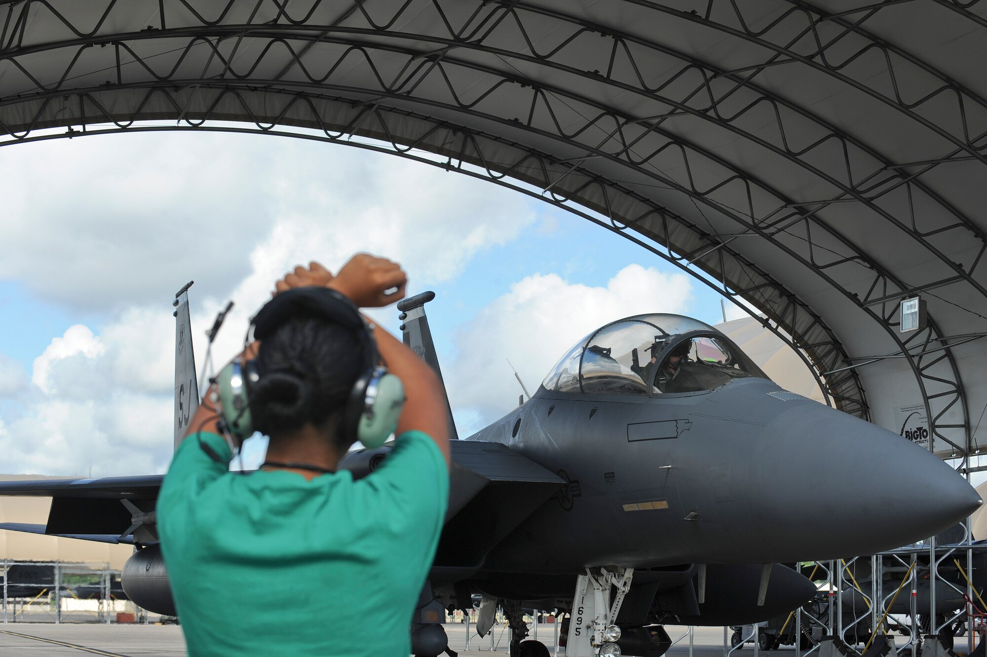 Airman Erika Reyes, 4th Aircraft Maintenance Squadron crew chief, marshals 1st Lt. Kevin Fogler, 335th Fighter Squadron F-15E Strike Eagle pilot, during Exercise Razor Talon on Sept. 5 at Seymour Johnson Air Force Base, North Carolina. Razor Talon is a monthly low-cost, large-force training opportunity for joint East Coast tactical and support aviation units. (U.S. Air Force photo/Airman 1st Class Aaron J. Jenne)