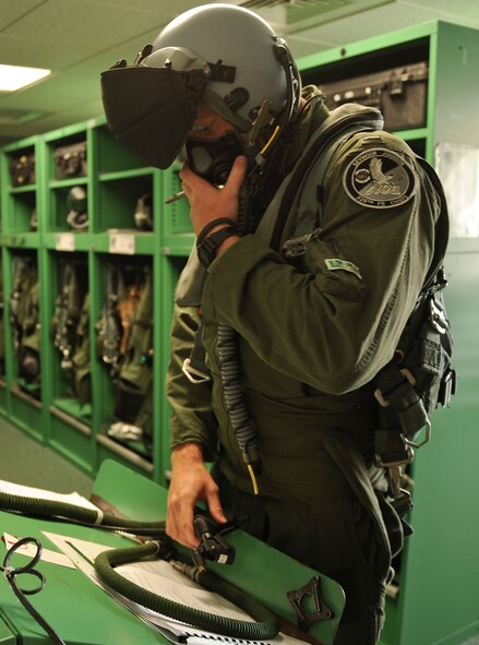 First Lt. Kevin Fogler, 335th Fighter Squadron F-15E Strike Eagle pilot, checks his mask in preparation for Razor Talon on Sep. 5 at Seymour Johnson Air Force Base, North Carolina. Razor Talon is a monthly low-cost, large-force training opportunity for joint East Coast tactical and support aviation units. (U.S. Air Force photo/Airman 1st Class Aaron J. Jenne)