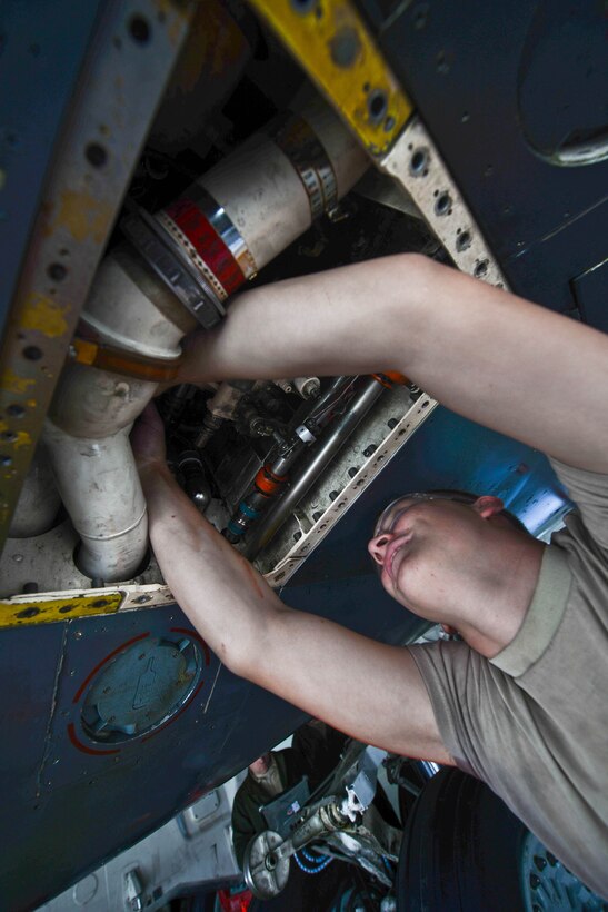 Airman 1st Class Zackary Wiggins, 28th Maintenance Squadron fuel system apprentice, checks a B-1 bomber fuel lines at Ellsworth Air Force Base, S.D., Sept. 3, 2014. Fuel system specialists are responsible for repairing, removing, inspecting, installing and modifying B-1 bomber fuel systems. (U.S. Air Force photo by Senior Airman Zachary Hada/Released)