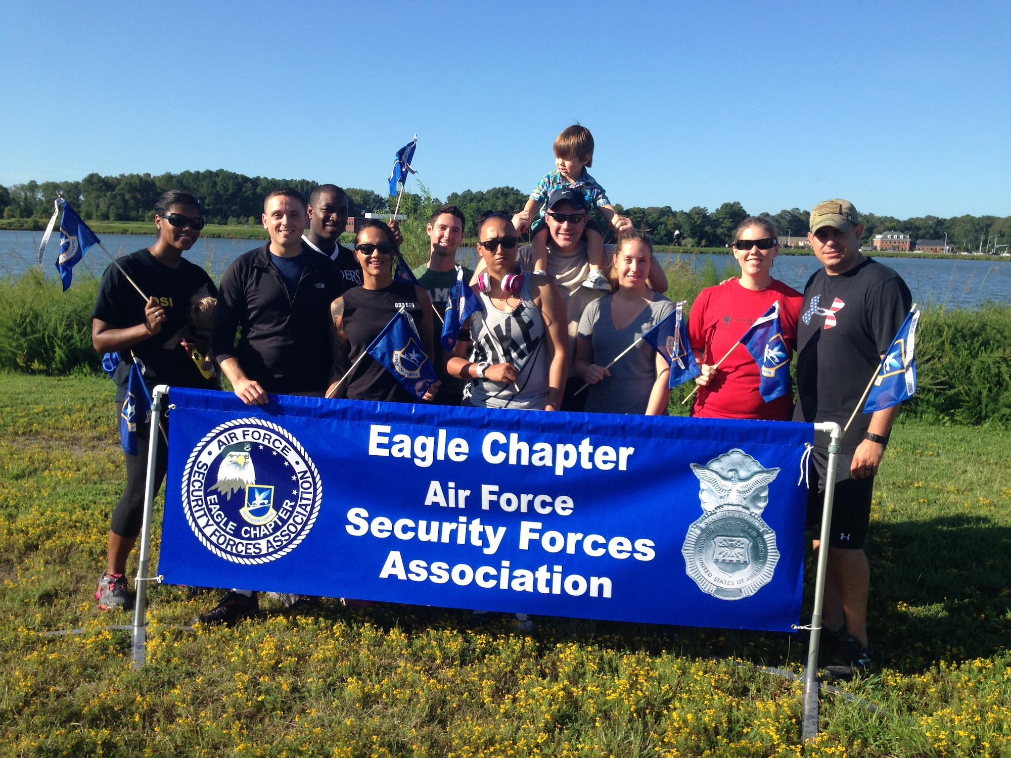 Members of the Security Forces Association Eagle Chapter assigned to Joint Base Langley-Eustis, Va., attend the Out of the Darkness community walk in Virginia Beach, Va., Sept. 6, 2014. The walk brought together members of the community and local U.S. Service members in support of mental health awareness. (Courtesy photo)