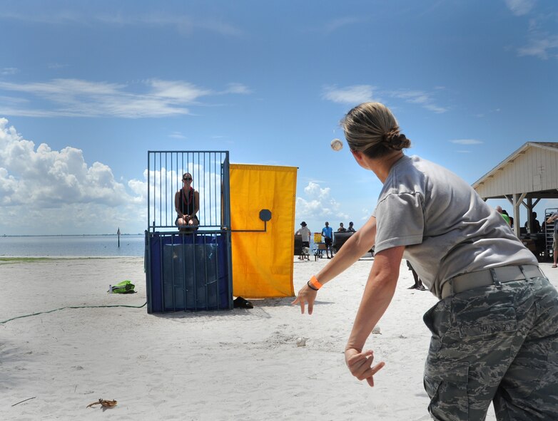 The 927 ARW hosted its annual family day 6 Sept. at the beach on MacDill AFB. Reservists and their family members enjoyed an afternoon of fun which included a barbeque, volleyball, dunk booth, and a car show. In addition to these activities families were given a demonstration by the 6 AMW military working dog handlers, and offered information from representatives of The Yellow Ribbon Program and Employer Support of Guard and Reserve (ESGR). (U.S. Air Force Photo / SSgt Adam C. Borgman)

