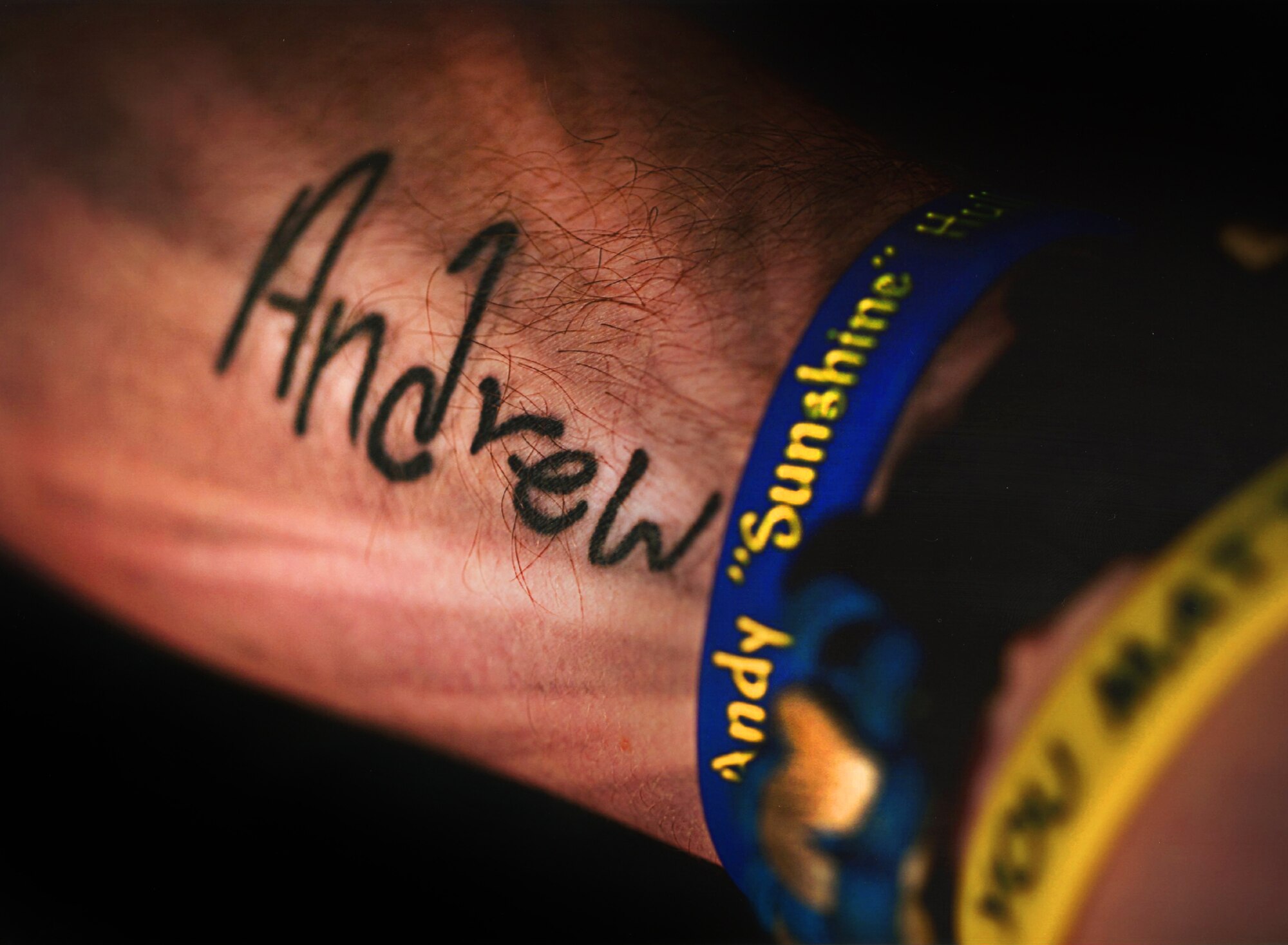 Staff Sgt. Joshua Hull, NCO in charge of the Minot Air Force Base Honor Guard, displays his tattoo in memory of his younger brother, Andrew Hull. Andrew died by suicide in December of 2012, when he was only 16-years-old. Since the incident, Hull has committed his time to spreading suicide awareness and prevention through the Andy Hull Sunshine Foundation. (Courtesy photo) 