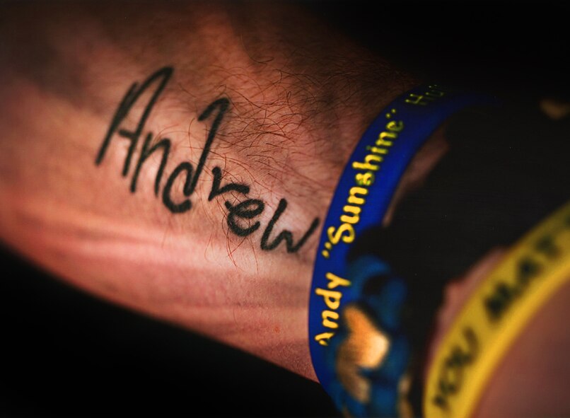 Staff Sgt. Joshua Hull, NCO in charge of the Minot Air Force Base Honor Guard, displays his tattoo in memory of his younger brother, Andrew Hull. Andrew died by suicide in December of 2012, when he was only 16-years-old. Since the incident, Hull has committed his time to spreading suicide awareness and prevention through the Andy Hull Sunshine Foundation. (Courtesy photo) 