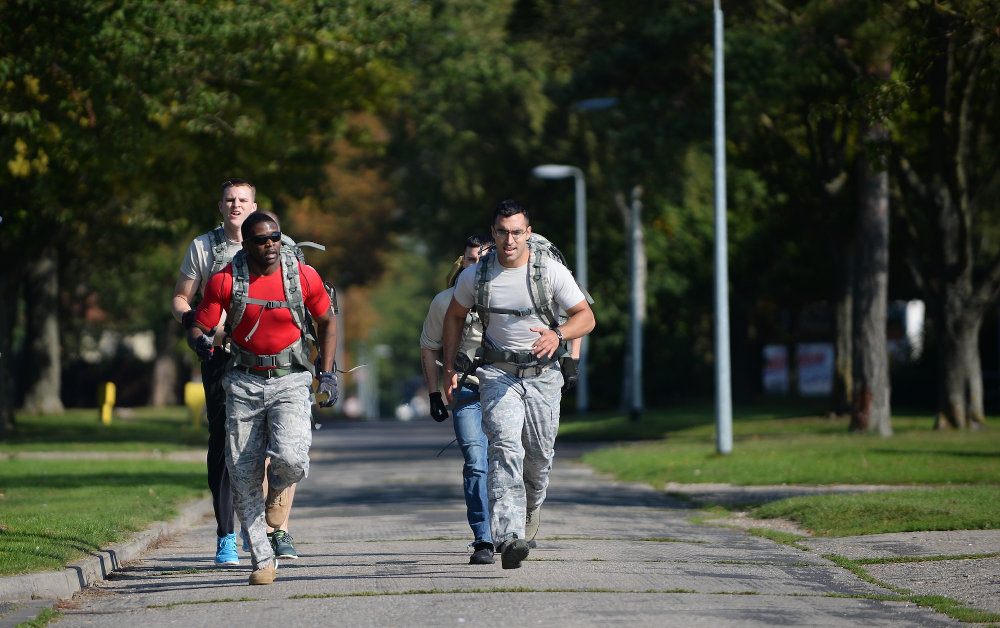 Members of the 48th Security Forces Squadron and 48th Civil Engineer Squadron race to finish Warrior Challenge between Royal Air Forces Lakenheath and Mildenhall first responders as part of a week-long Battle of the Badges competition on RAF Feltwell, England, Sept. 8, 2014. Team Lakenheath won the competition with a time of 36:36 over team Mildenhall’s 40:55. (U.S. Air Force photo by Staff Sgt. Emerson Nuñez/Released)