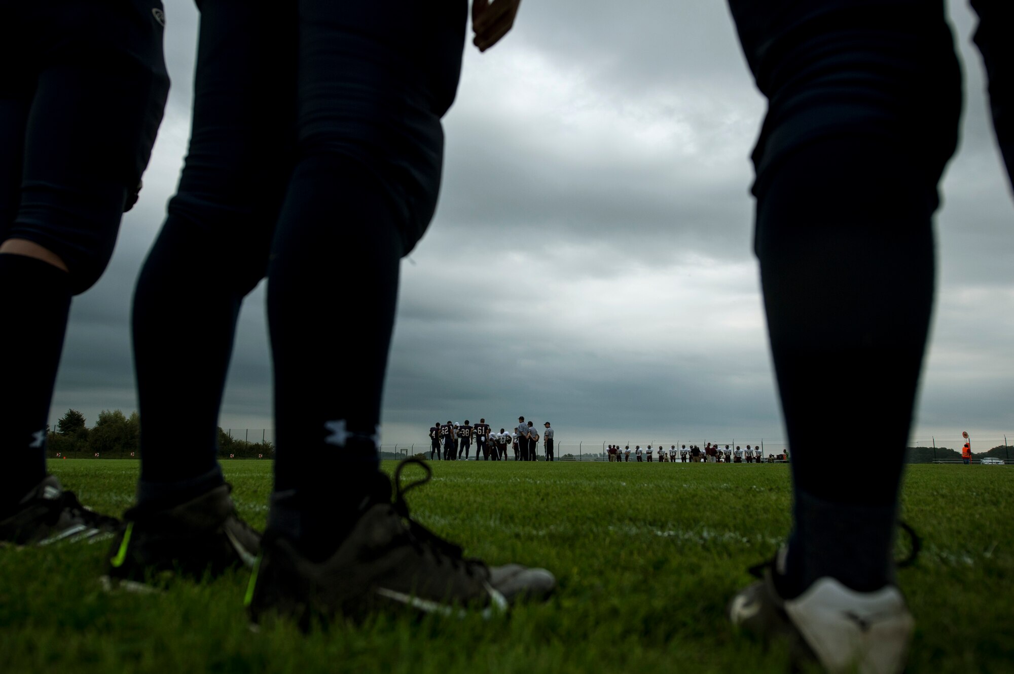 Bitburg Barons football team captains participate in the coin toss prior to the start of their game against the Baumholder Buccaneers Sept. 6, 2014, at Bitburg Annex, Germany. The game kicked off the 2014 season for the Barons. (U.S. Air Force photo by Senior Airman Rusty Frank/Released)