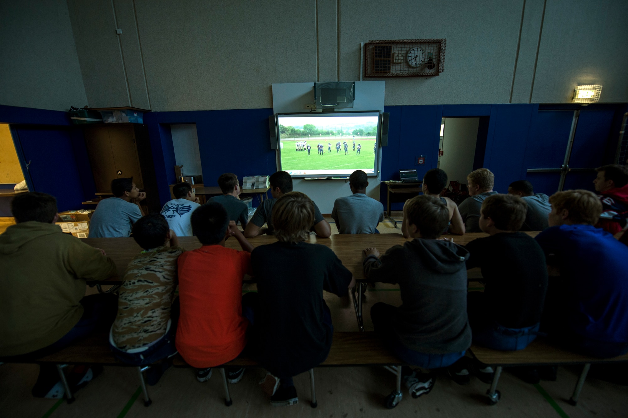 Bitburg Barons football players watch game film prior to the start of their season opener game against the Baumholder Buccaneers Sept. 6, 2014, at Bitburg Annex, Germany. The team plays five games during the course of the regular season. (U.S. Air Force photo by Senior Airman Rusty Frank/Released)