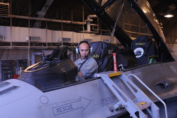 Staff Sgt. Gene San Nicolas, 14th Aircraft Maintenance Unit crew chief, performs a fuel transfer on an F-16 at Misawa Air Base, Japan, Sept. 4, 2014. As a crew chief NCO, he is responsible for maintaining the 35th Fighter Wing’s aircraft and teaching his subordinates to do the same. San Nicolas, who has only been stationed here four months, has been selected as his unit’s Wild Weasel of the Week for his outstanding performance. (U.S. Air Force photo/Staff Sgt. Alyssa C. Wallace)