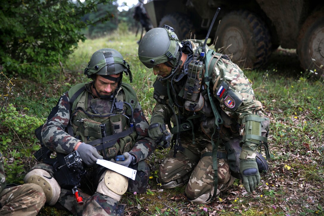 Slovenian soldiers examine their map during the Saber Junction 2014 training exercise on the Joint Multinational Readiness Center in Hohenfels, Germany, Sept. 2, 2014.