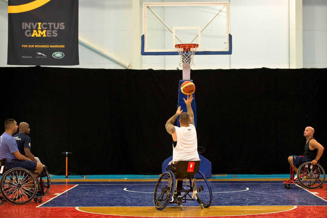 Steven Davis shoots a free throw during a wheelchair basketball practice Sept. 8, 2014, at Mayesbrook Field Sport House in London. Davis is a member of the U.S. wheelchair basketball team for the inaugural Invictus Games. 
