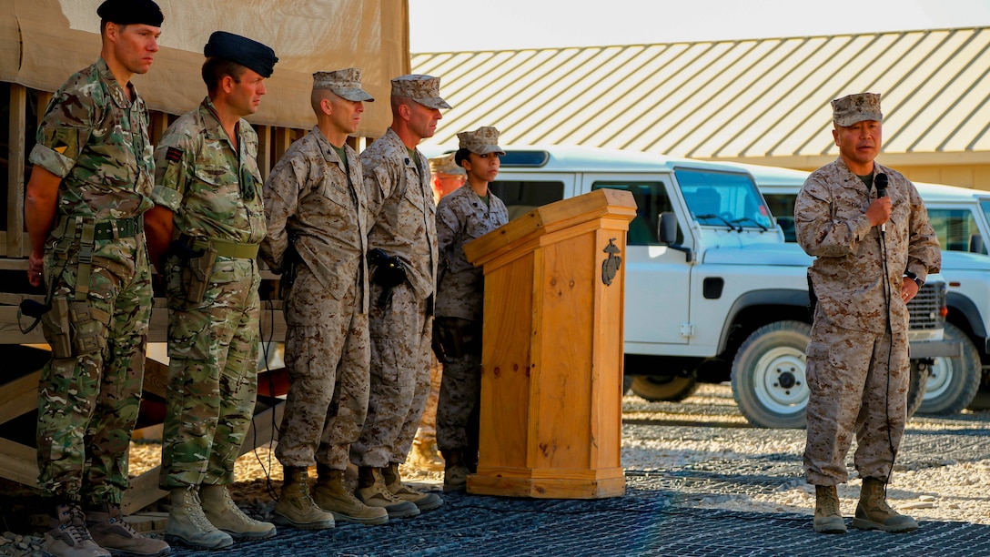 Brigadier Gen. Daniel D. Yoo, commander, Regional Command (Southwest) and Marine Expeditionary Brigade – Afghanistan, speaks to Marines, sailors and coalition partners during a 9/11 ceremony held aboard Camp Leatherneck, Afghanistan, Sept. 11, 2014. “Today’s simple but solemn ceremony is a tribute to those innocent young men, women and children who were killed by a cowardly and heartless act of terror,” said Yoo.