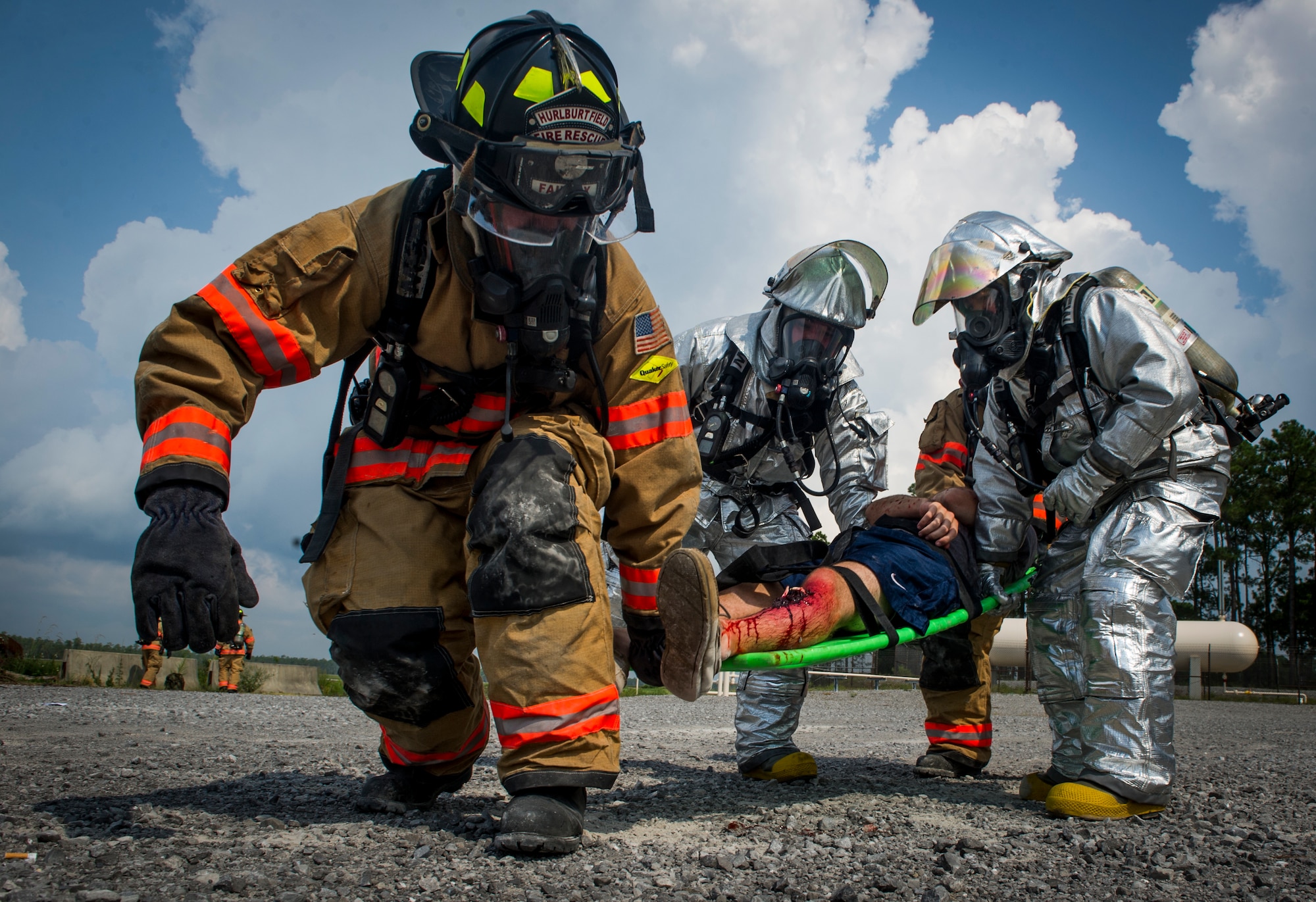 1st Special Operations Civil Engineer Squadron firefighters assist a role-playing victim during Exercise Commando Terror at Hurlburt Field, Fla., Sept. 8 2014. During the exercise, Airmen responded to a simulated bomb explosion and assisted the affected victims. (U.S. Air Force photo/Senior Airman Christopher Callaway) 
